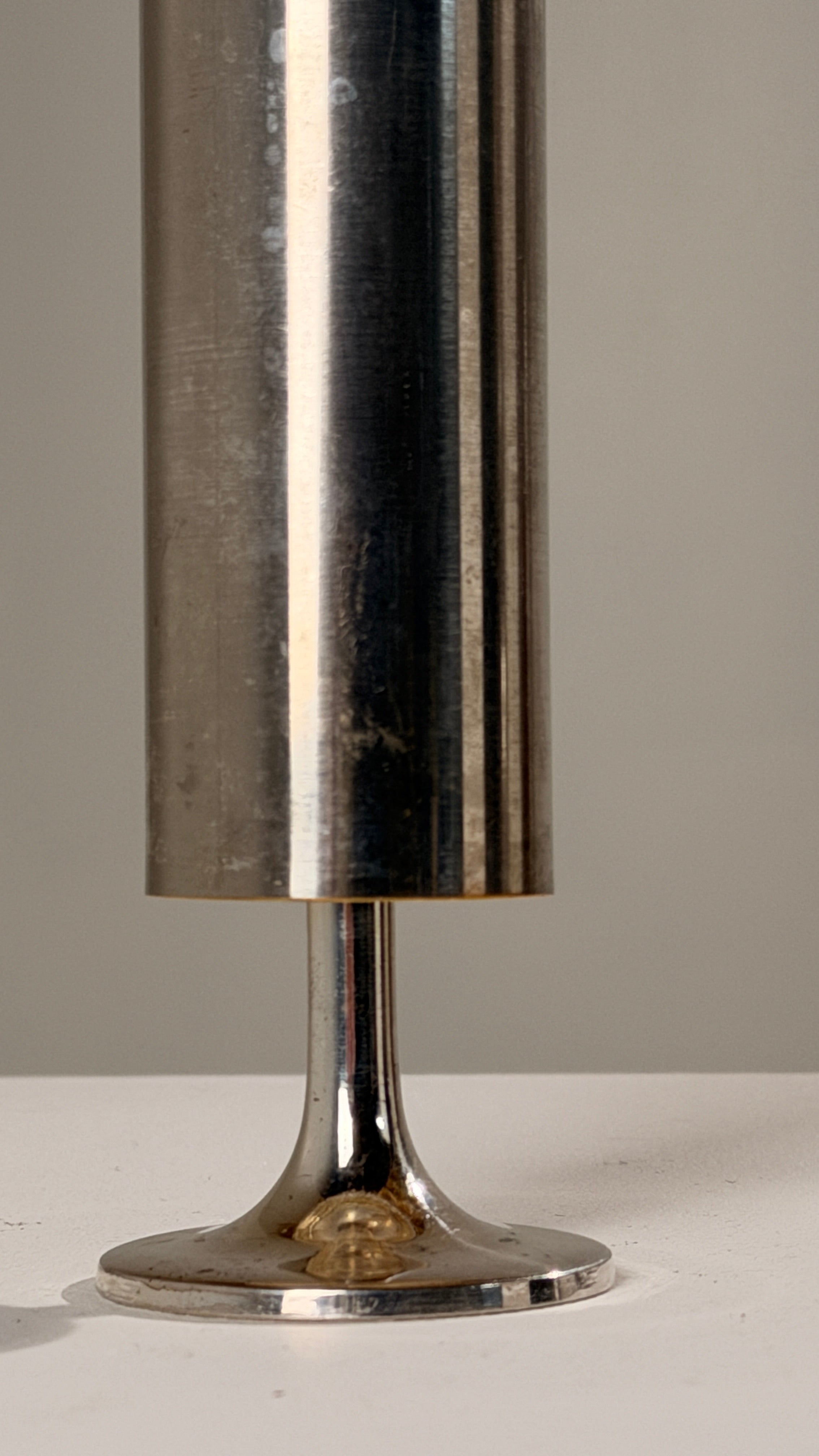 Large Silver-plated Metal Candleholder, France, circa 1970 — side view on white surface