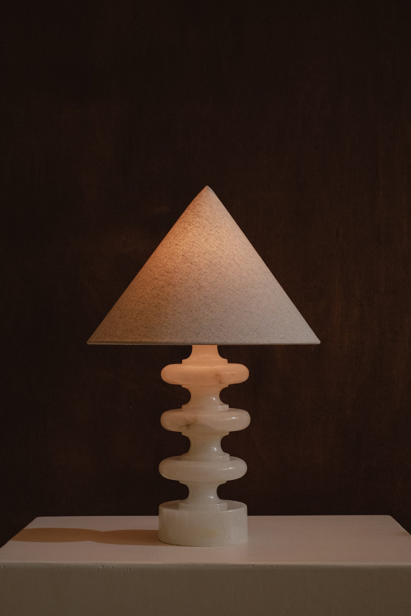 Sculptural Alabaster Table Lamp — back view with soft light glow