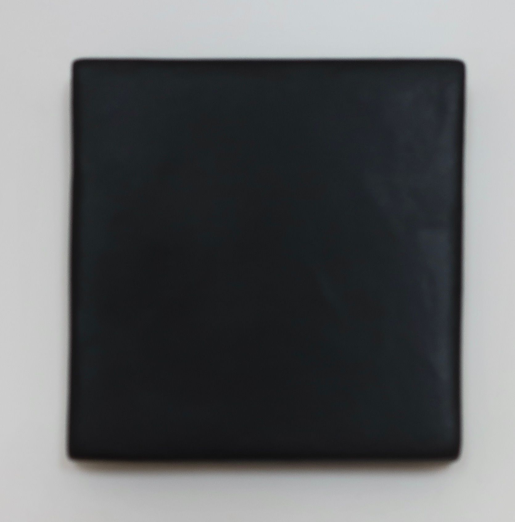 Dark square mirror with sleek black frame by ORRE Studio