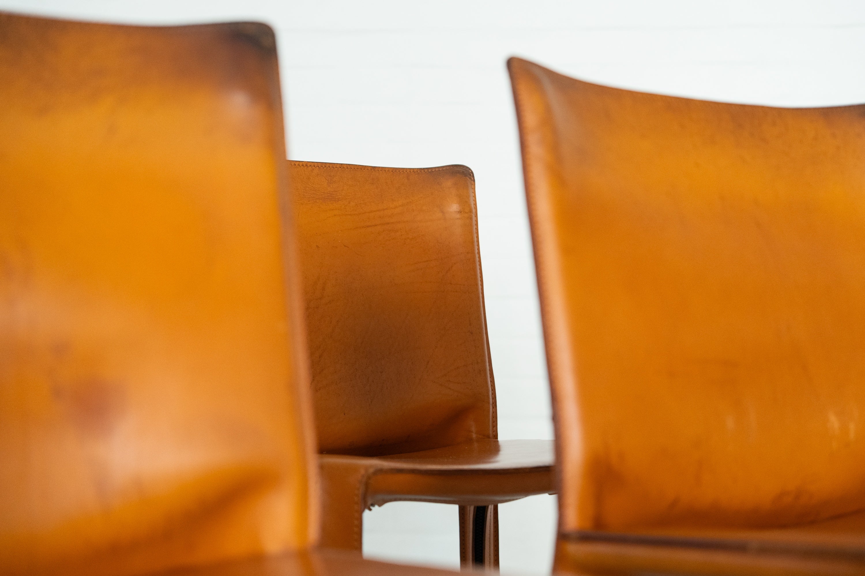 Cab 412 Chair Set by Mario Bellini for Cassina — side angle of tan leather chairs