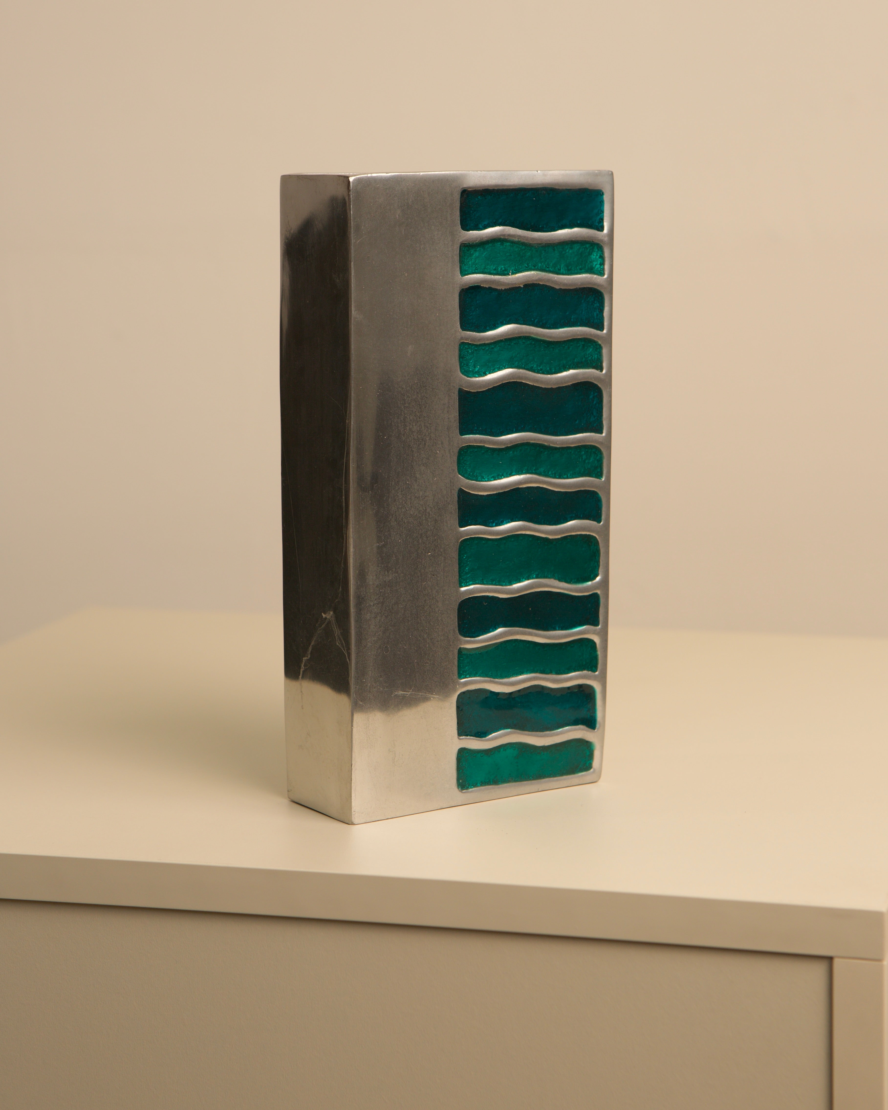 Vintage green enameled aluminum vase with wavy striped pattern 1970s