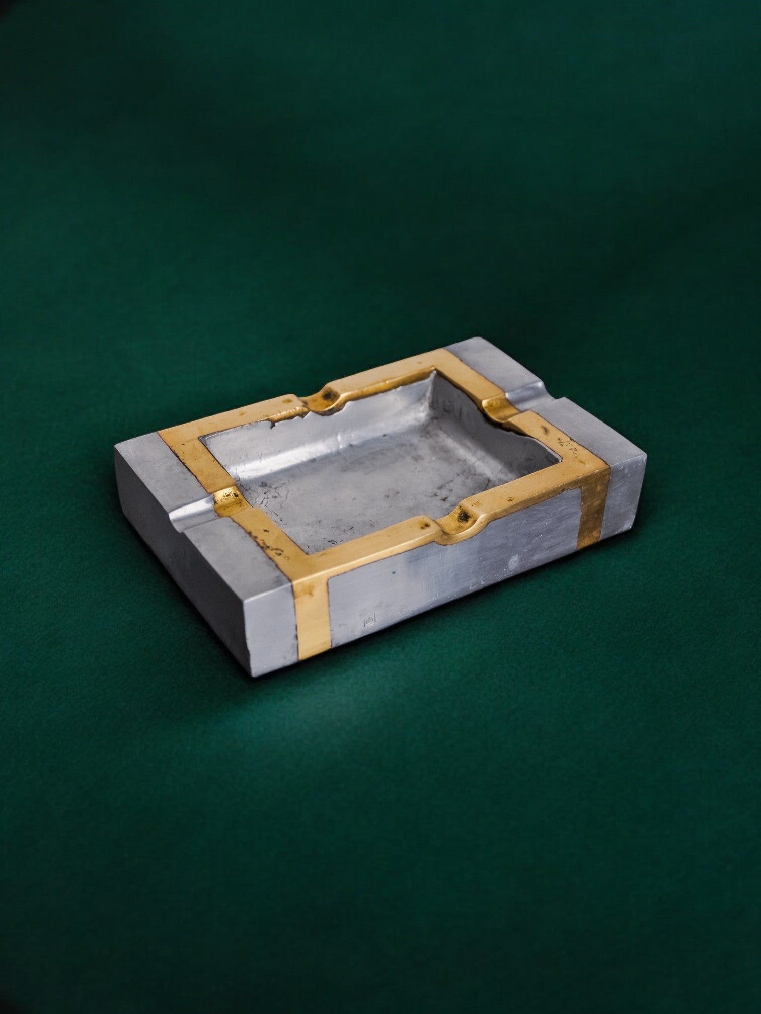 Brutalist Ashtray by David Marshall, 1970s — angled view on green background