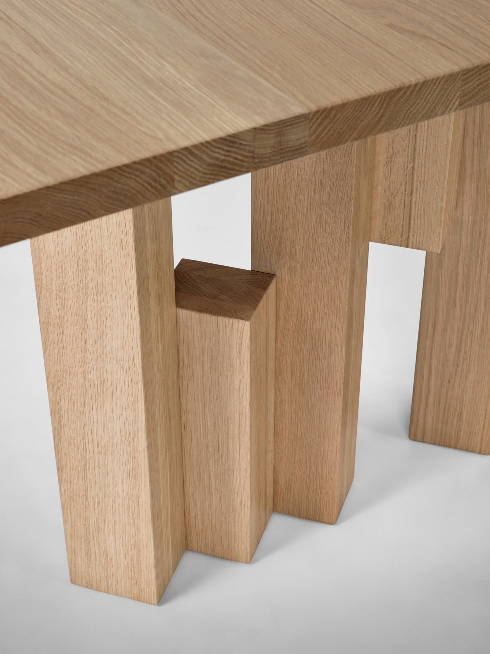 Fenestra Table — close-up of light oak legs and tabletop