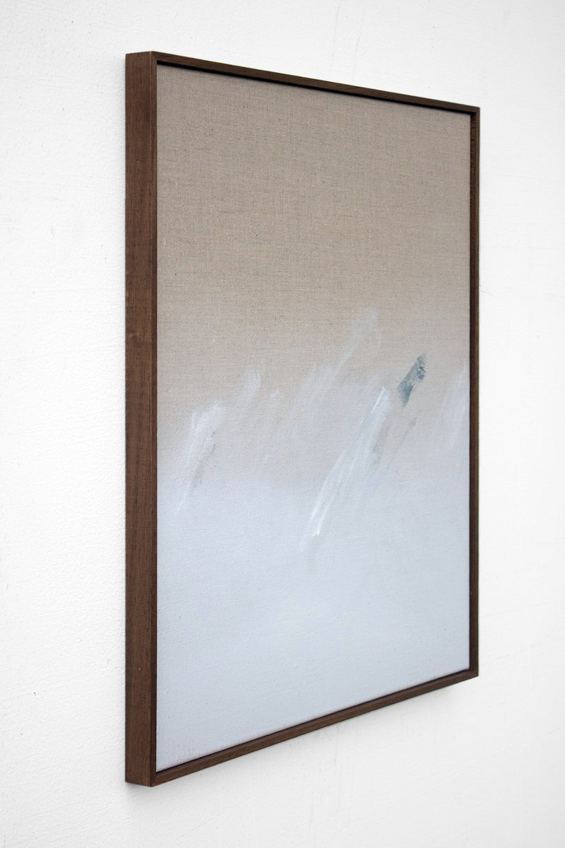 Holding — Acrylic on Linen by David Hardy is a minimalist artwork in a wooden frame, featuring soft abstract brushstrokes and a beige-to-white gradient, shown from a side angle.