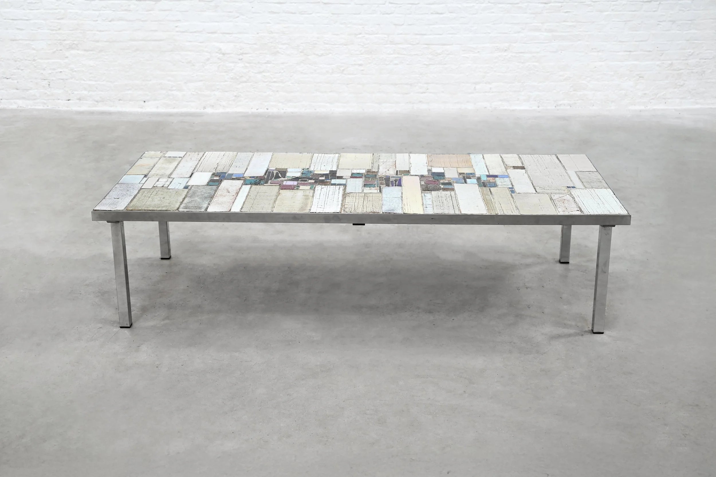 Brutalist Coffee Table by Pia Manu — front view with mixed material top