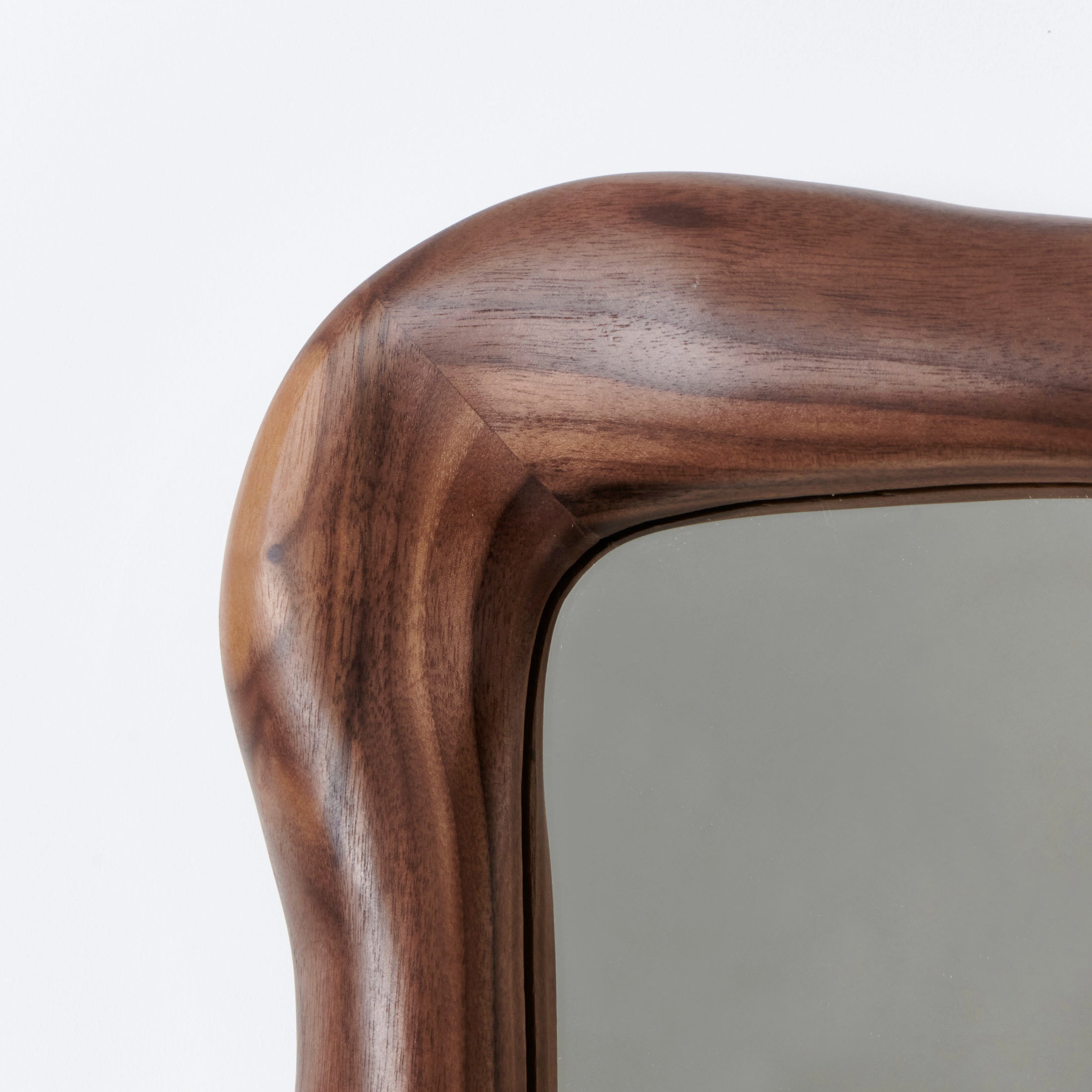 Minho Mirror — side angle showing rounded walnut frame