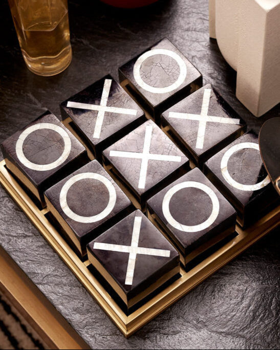Deco Tic Tac Toe — top view on dark stone tabletop