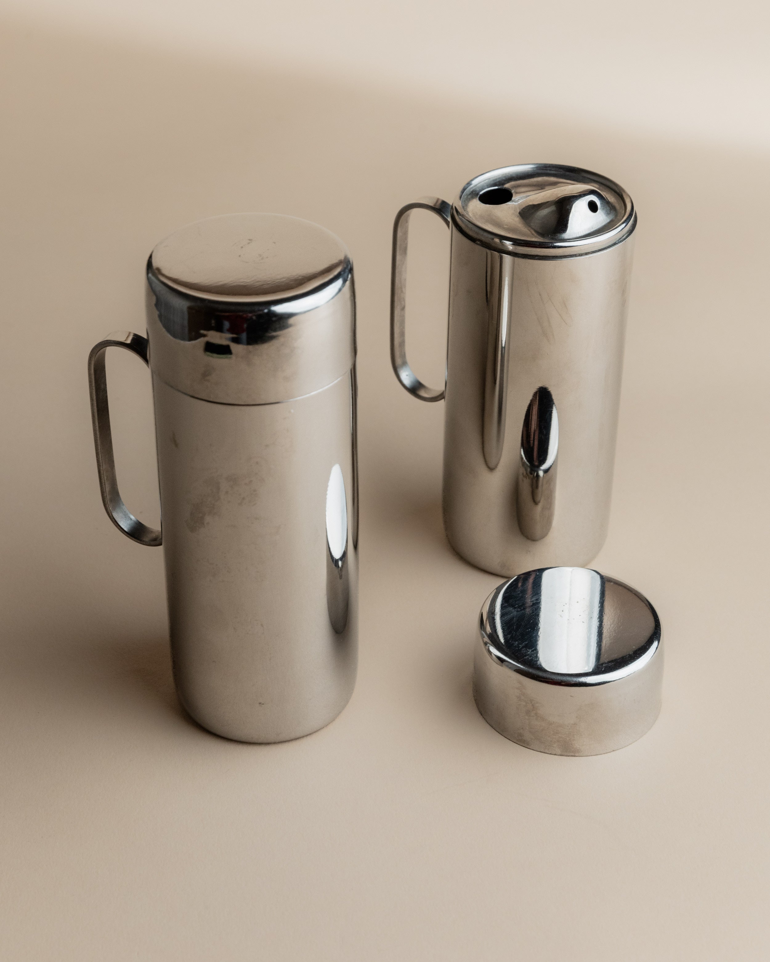 1980s stainless steel oil and vinegar cruet set with handles