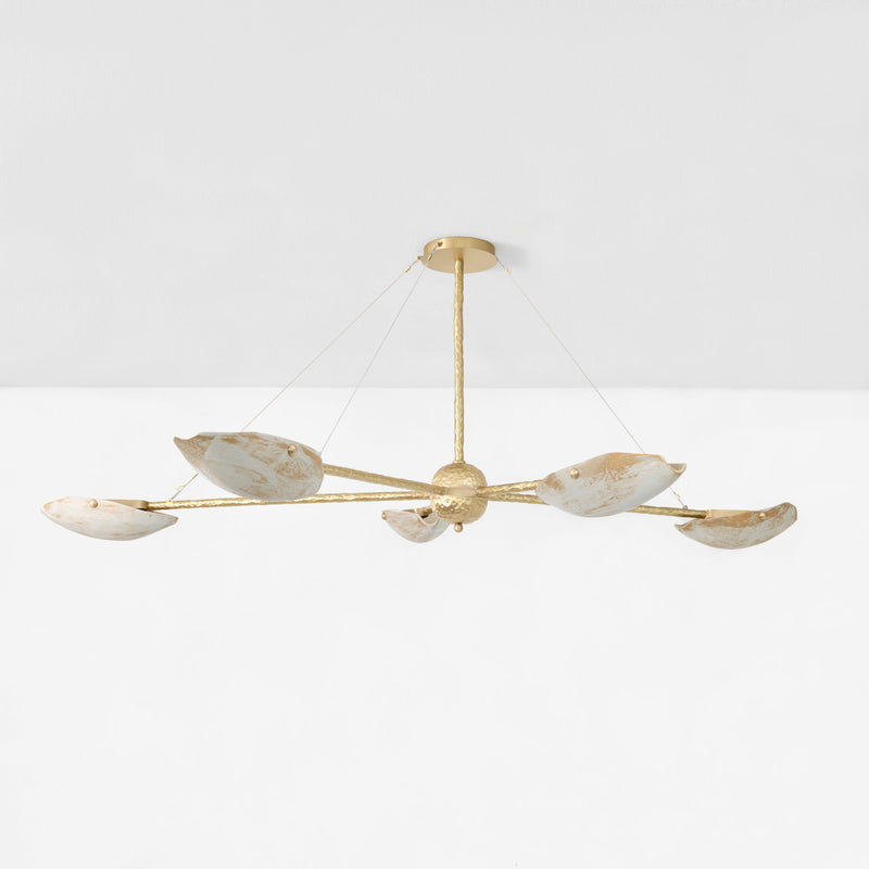 Serrallés Chandelier — close-up of gold metal arms with white shades