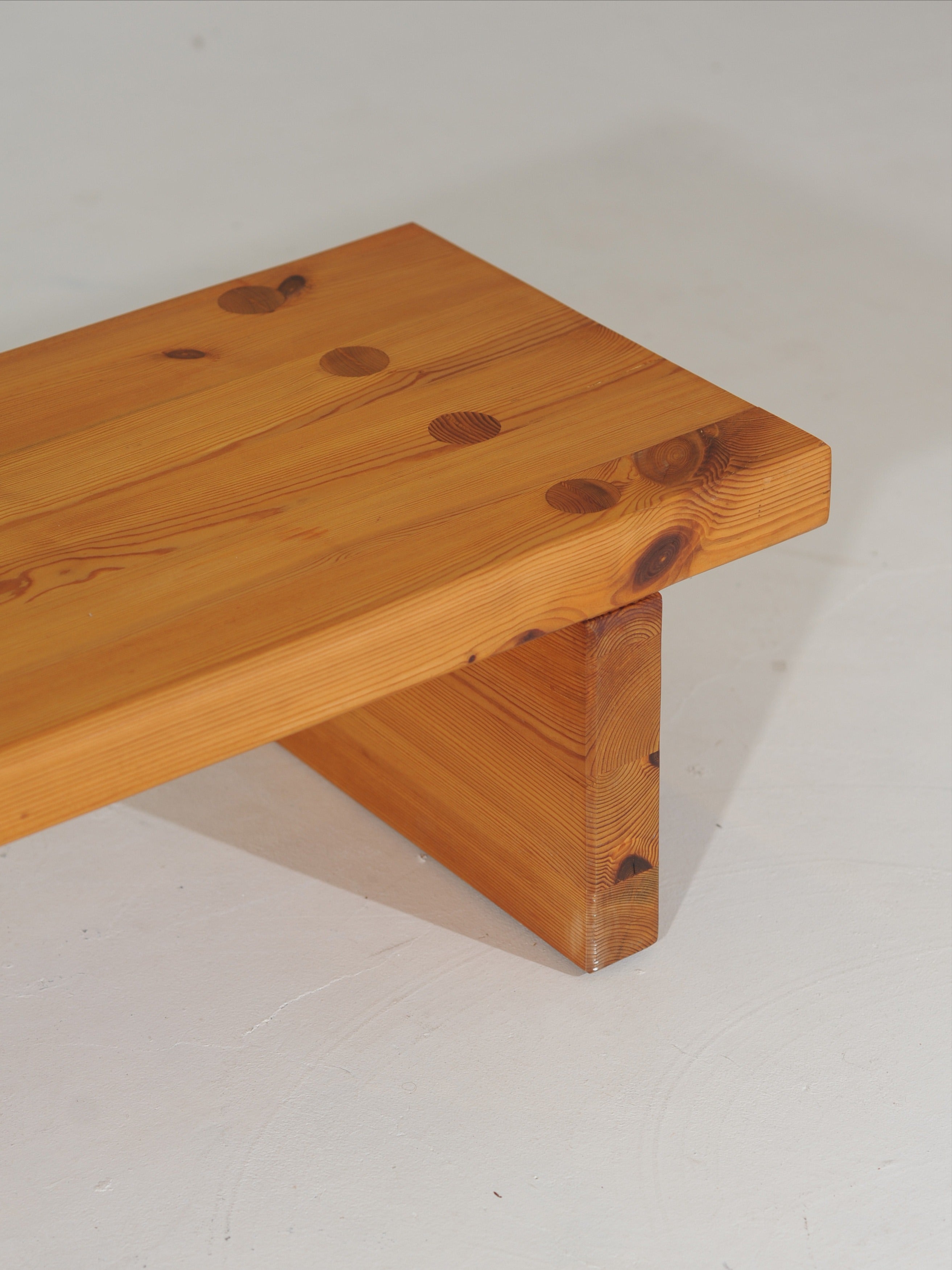 Close-up detail of pine wood grain and joinery on Swedish bench