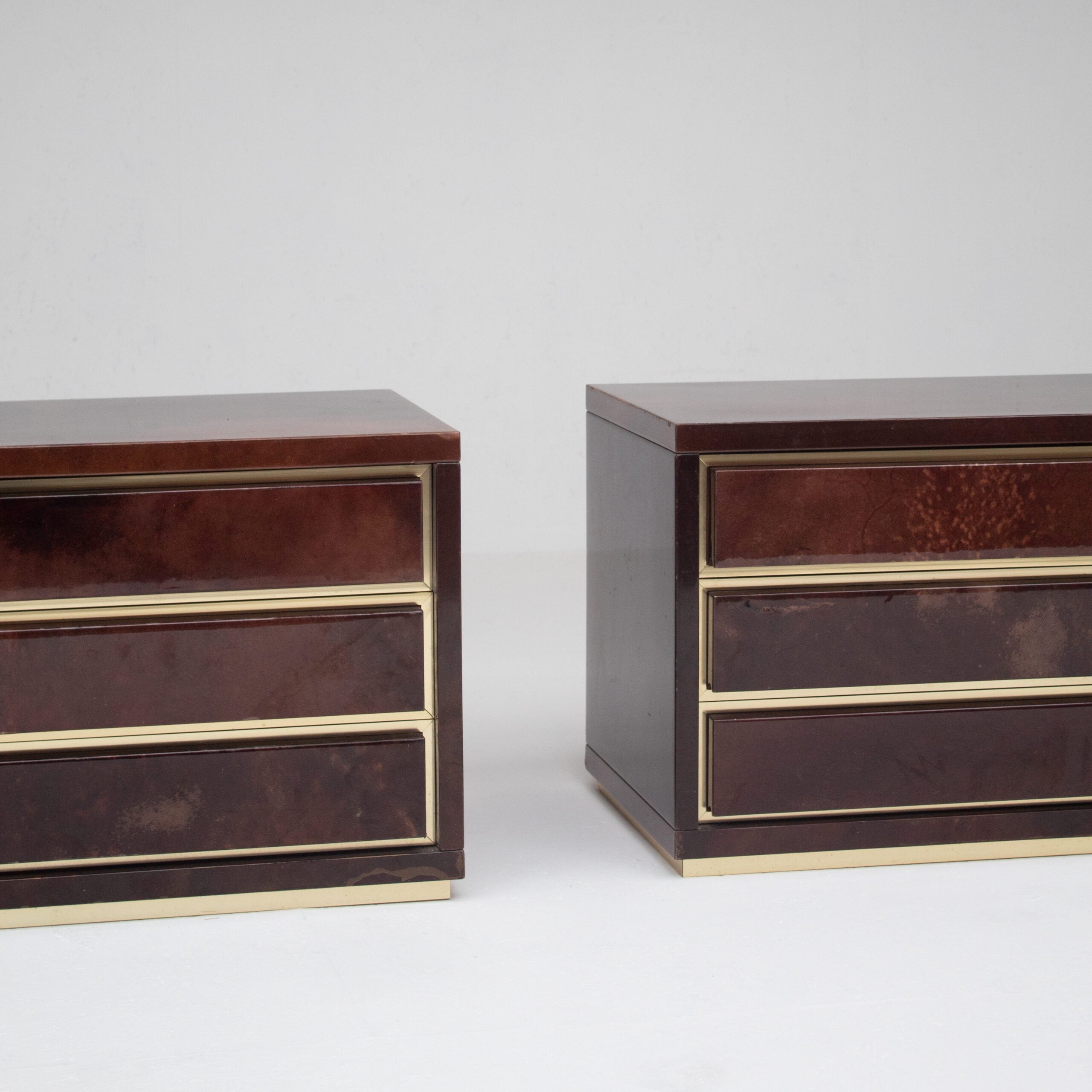 Pair of Aldo Tura (attr) Nightstands in Parchment and Brass — side angle showing brass accents and dark finish