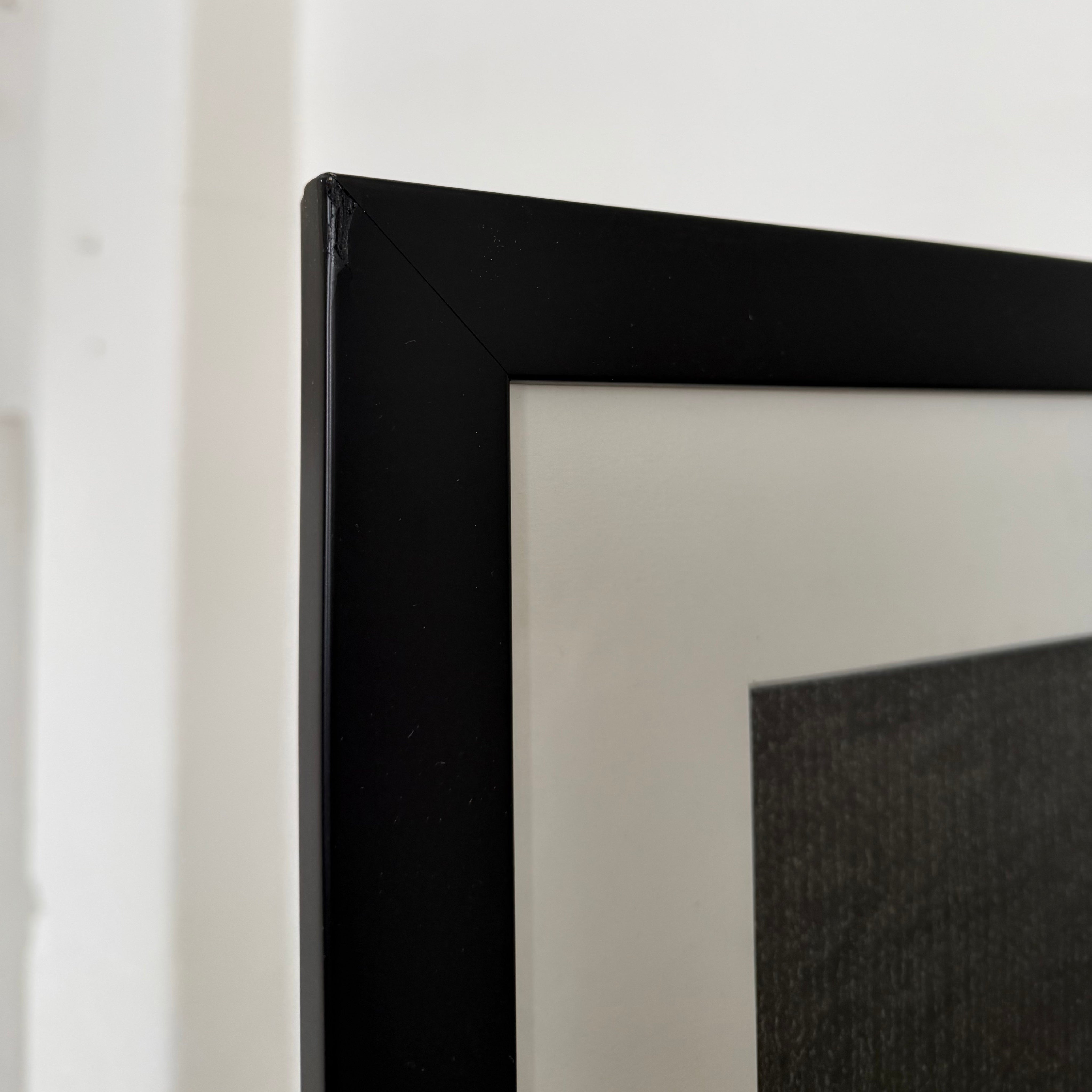 Mabel Martín Academic Nude Charcoal Drawing — close-up of black frame corner