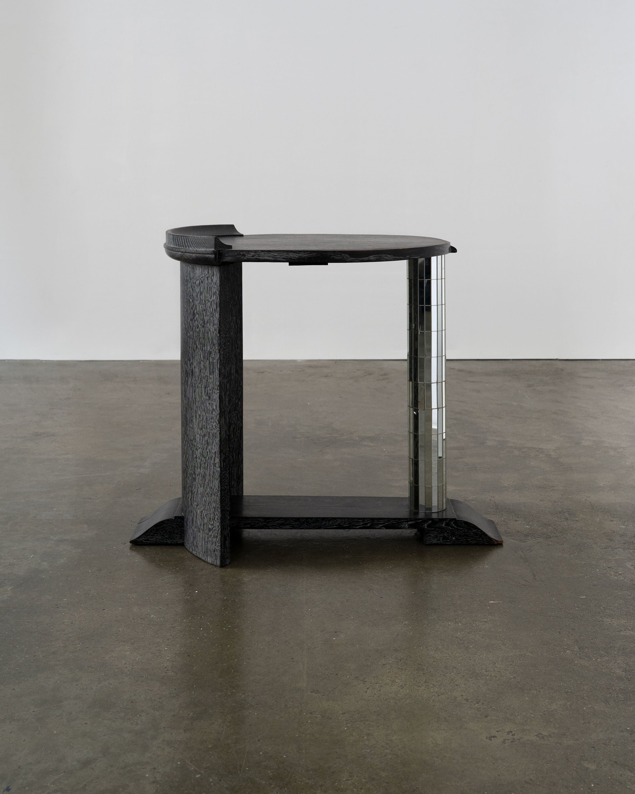 Modernist Ebonised Oak and Mirror Mosaic Pedestal Table — side angle showing mirrored column and textured surface