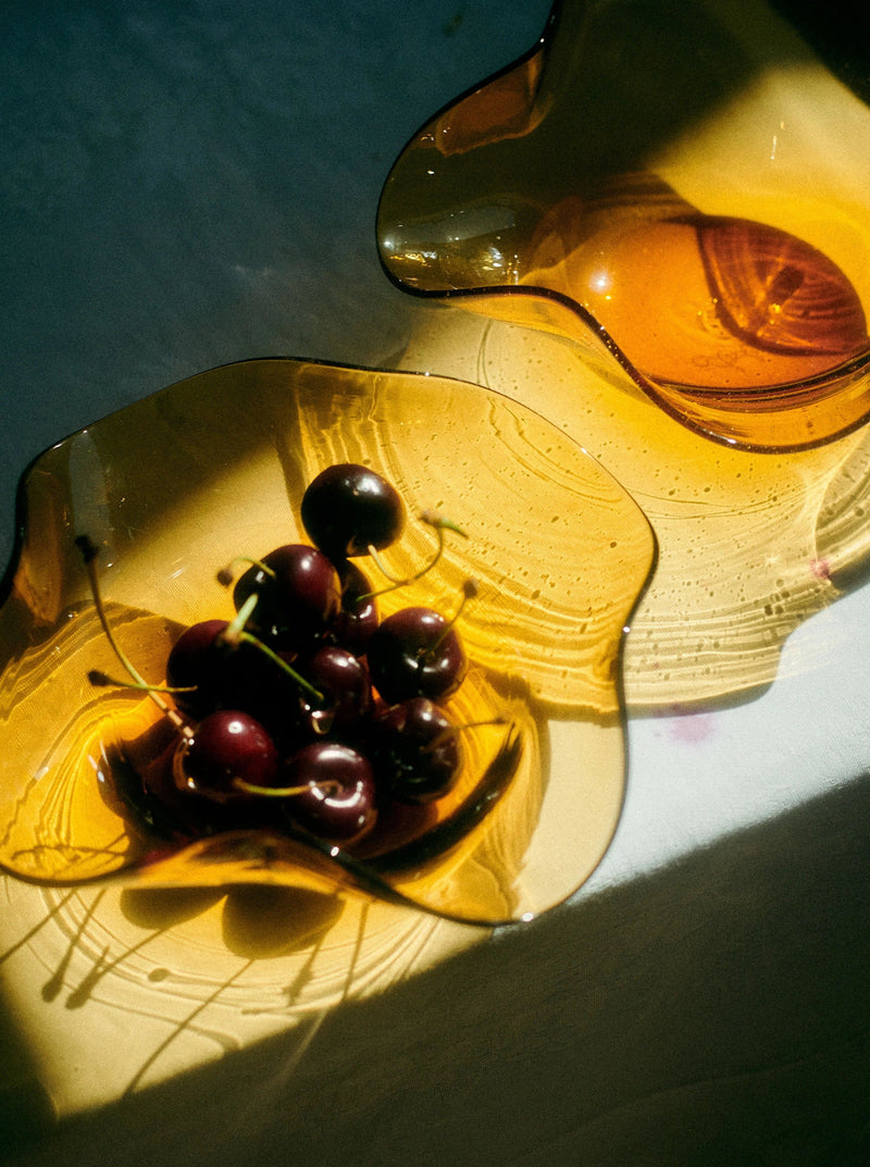 Michele Bowl Small — close-up of amber glass bowl with cherries