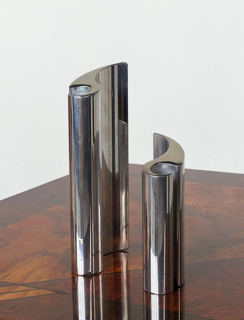 Curved Polished Sculpture Pair — close-up of shiny metal surface