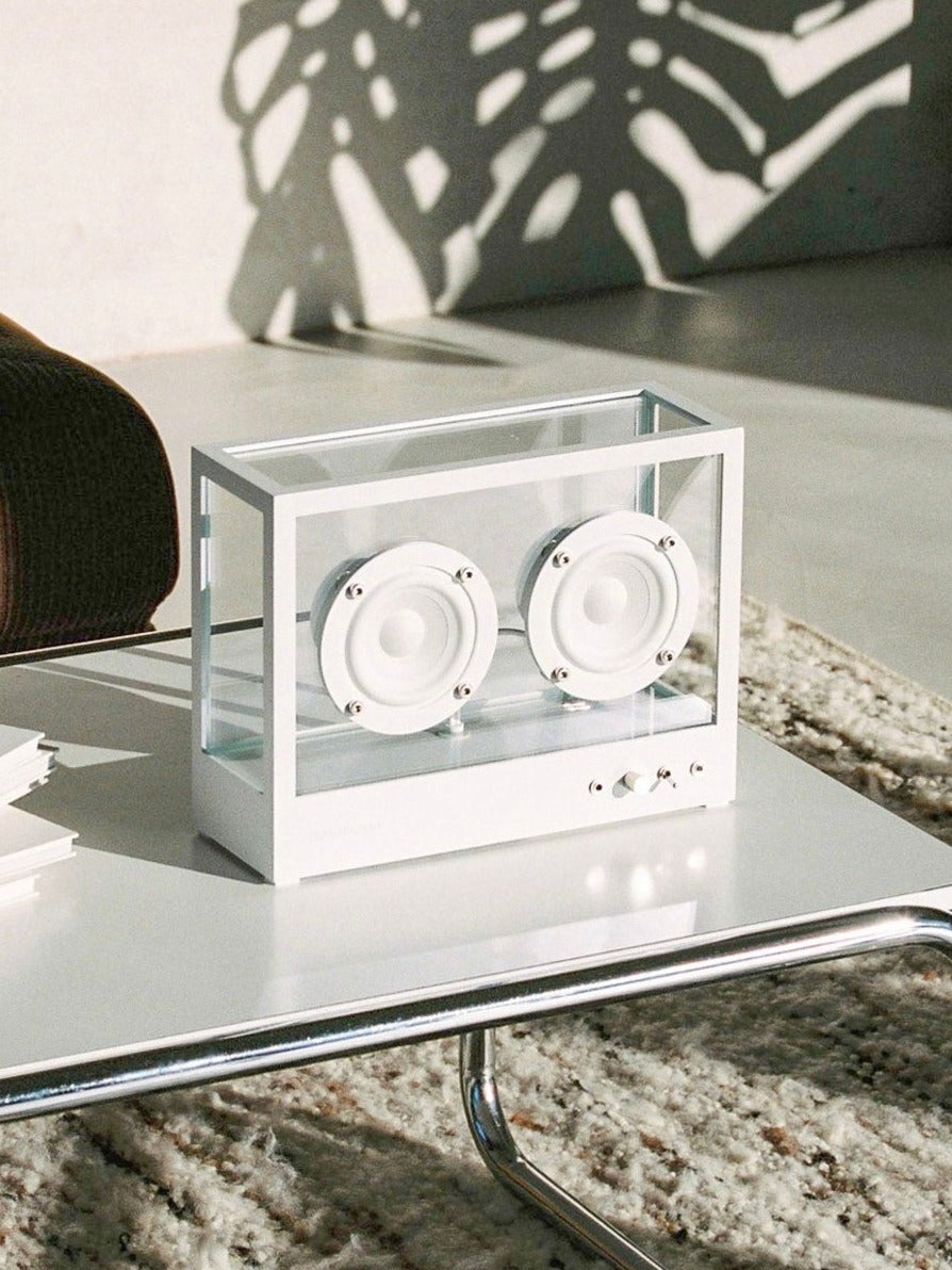 Small Transparent Speaker White - Bluetooth — side angle on coffee table