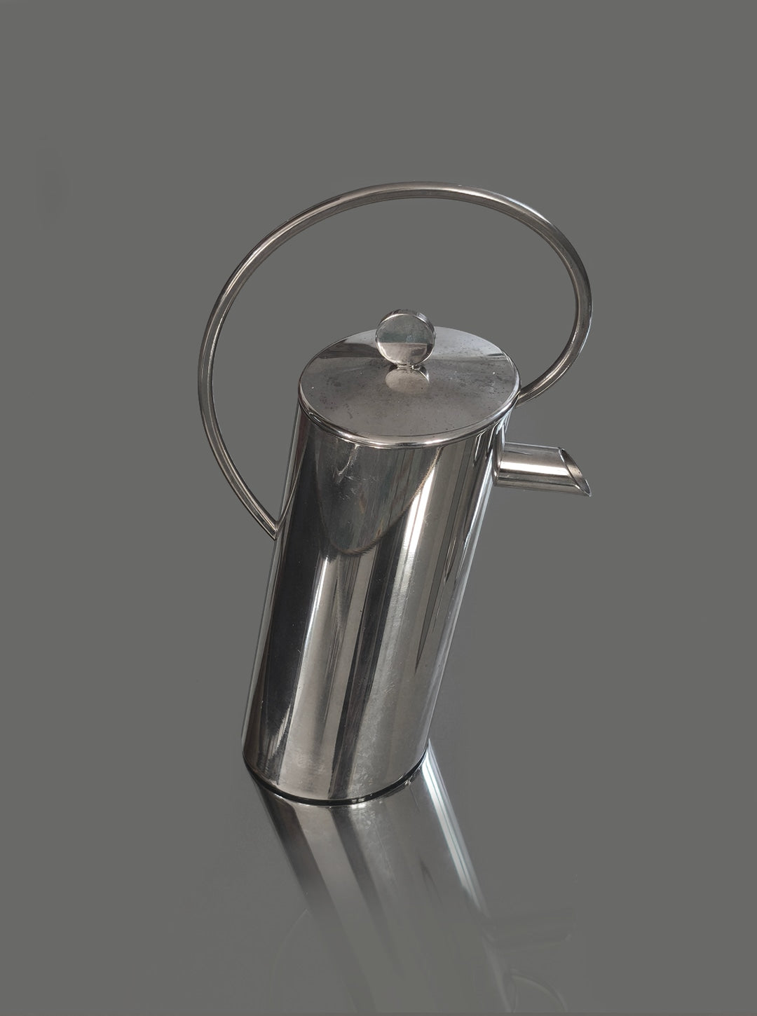 Silver-plated Italian coffee pot with elegant curved handle detail