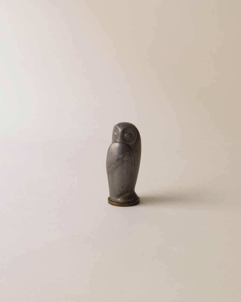 Pewter owl stamp profile view showing carved feather details 1930s