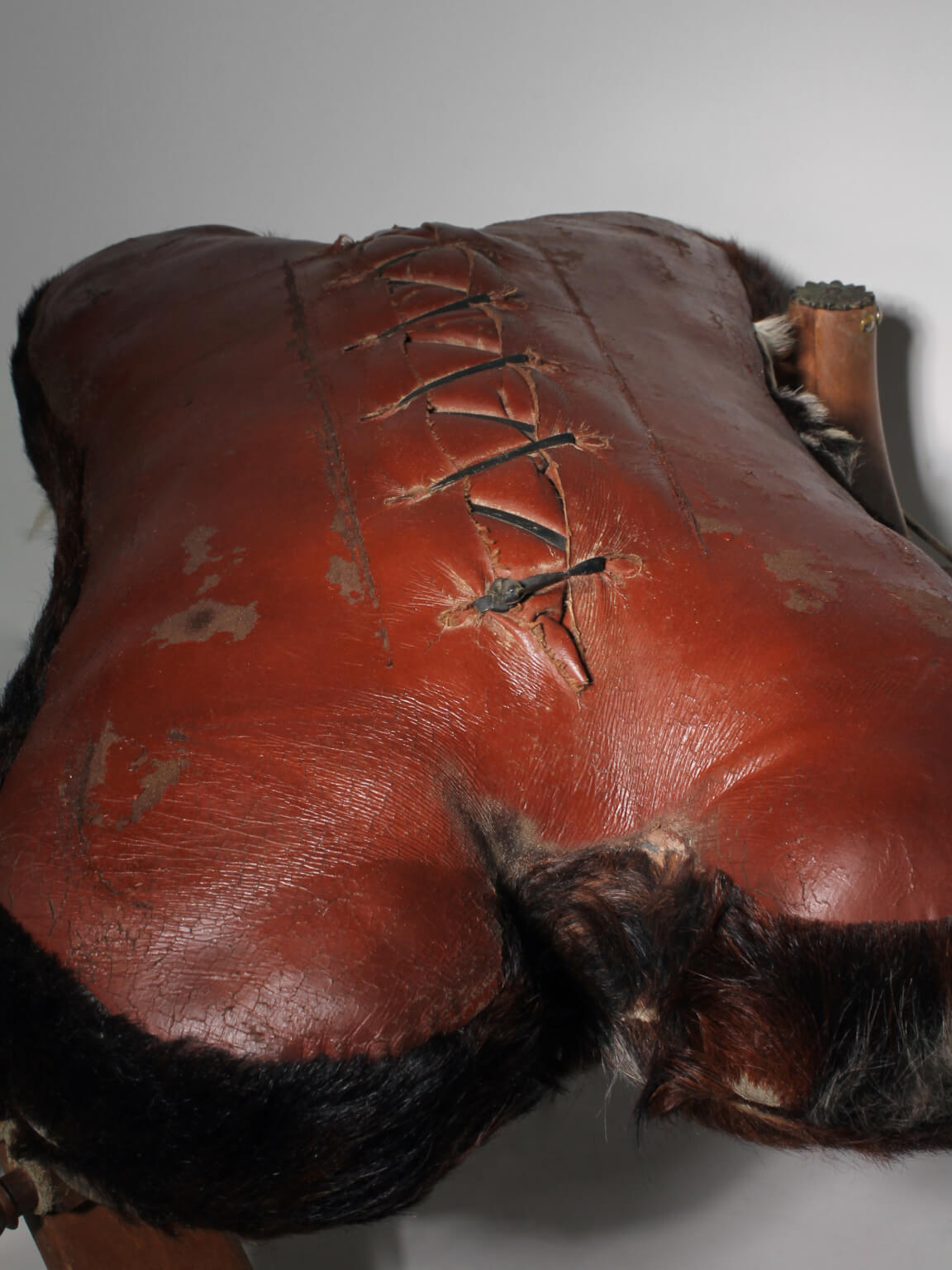 Cowhide Camel Saddle Stool — close-up
