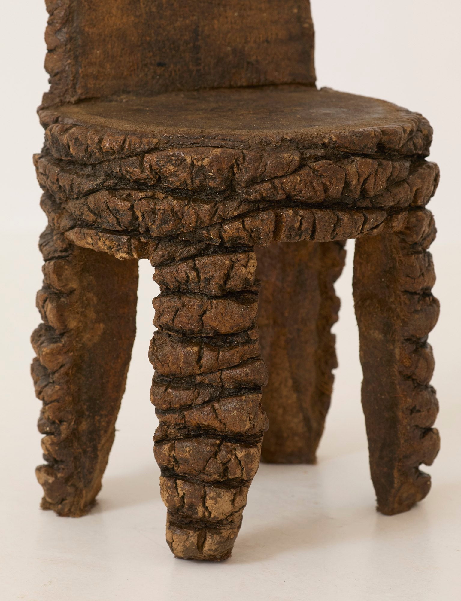 Small Artisanal Brutalist Chair in Solid Palm Tree C. 1970 — close-up of textured palm tree legs