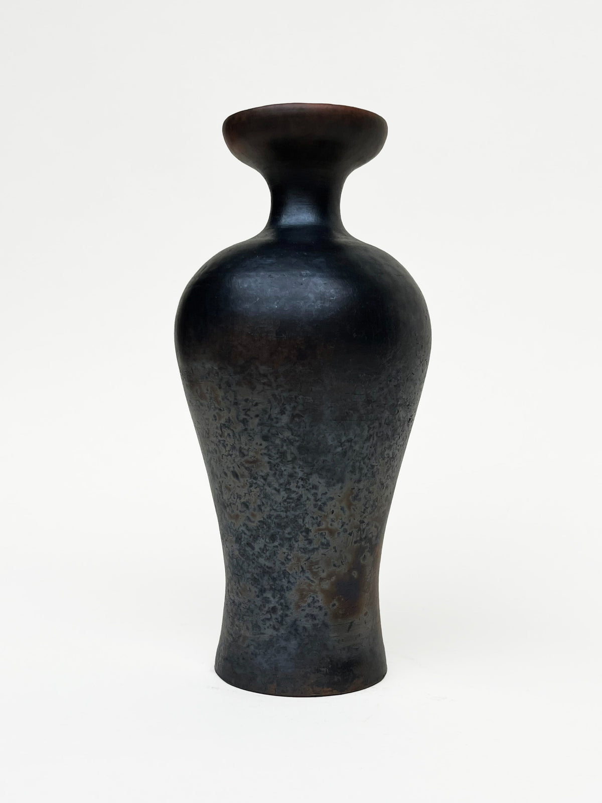 Narang Vase – Terra sigillata, metallic smoke-fired raku — lifestyle setting
