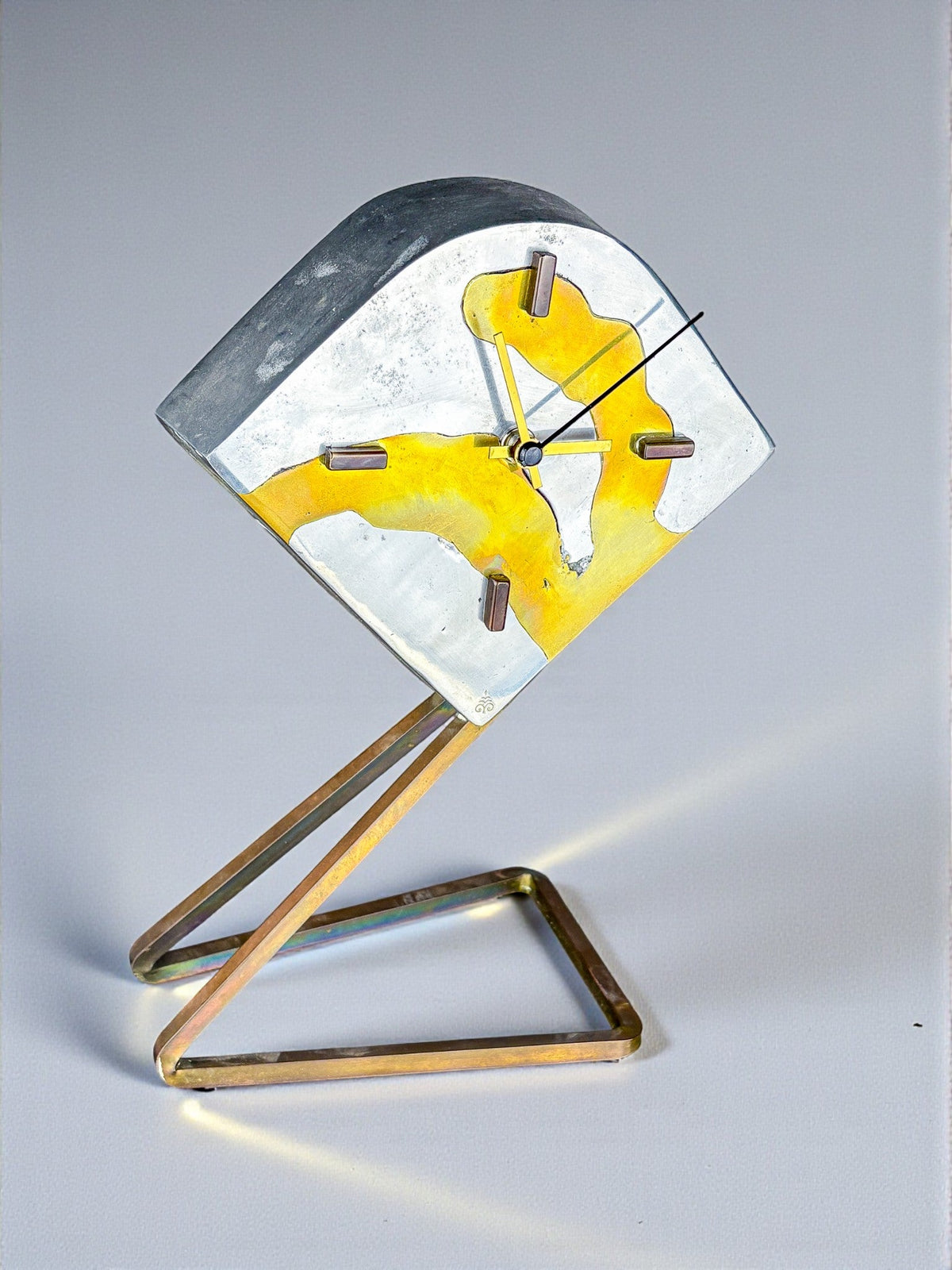 Brutalist clock by Leopold, bronze and aluminum, 1970, Spain — lifestyle setting