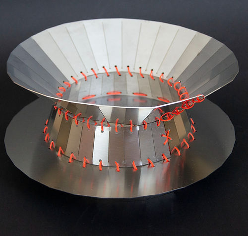 Mina - Centerpiece — top view of metallic dish with orange stitching
