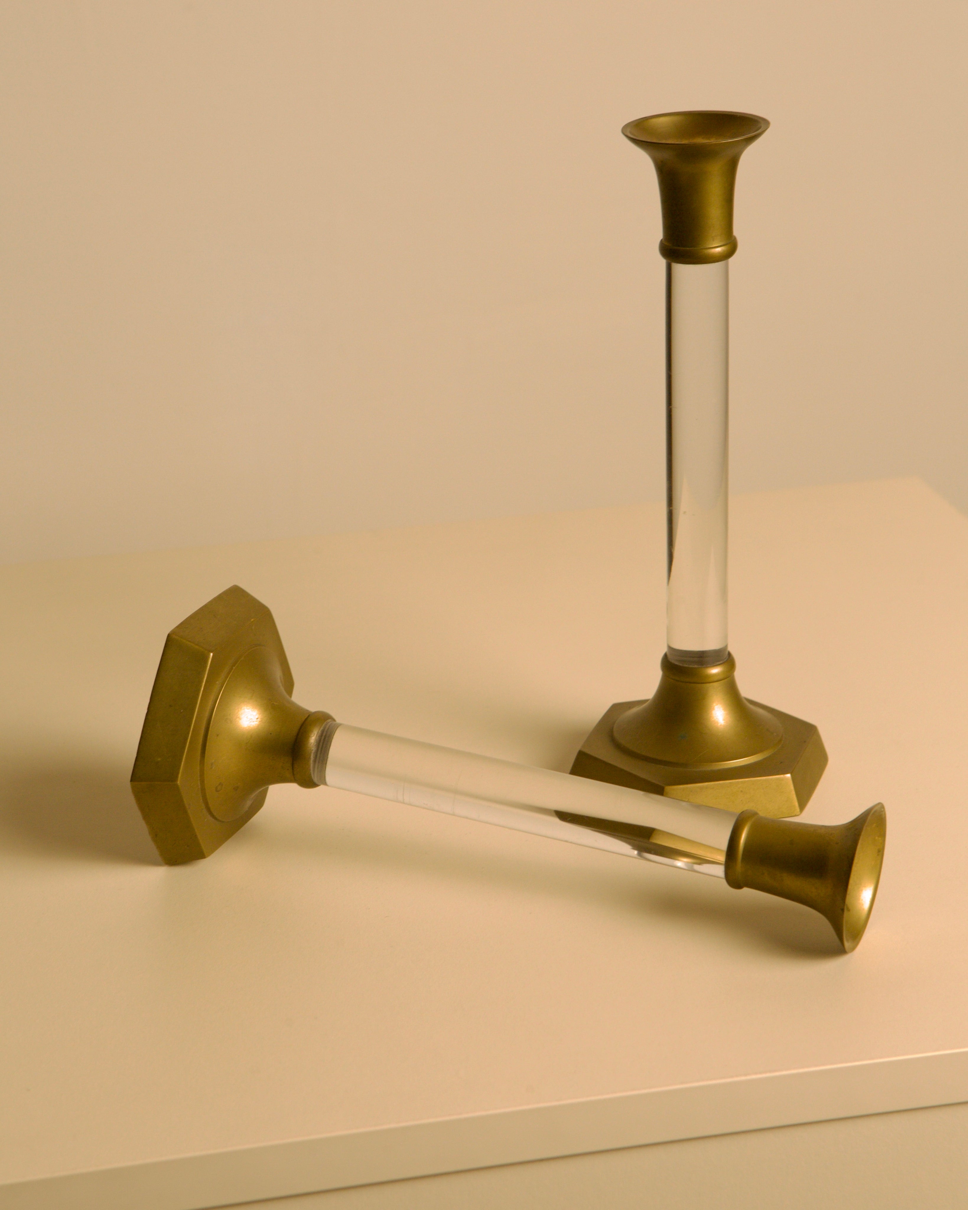 Pair of Italian Brass and Lucite Candlesticks, 1960s — side angle on white surface