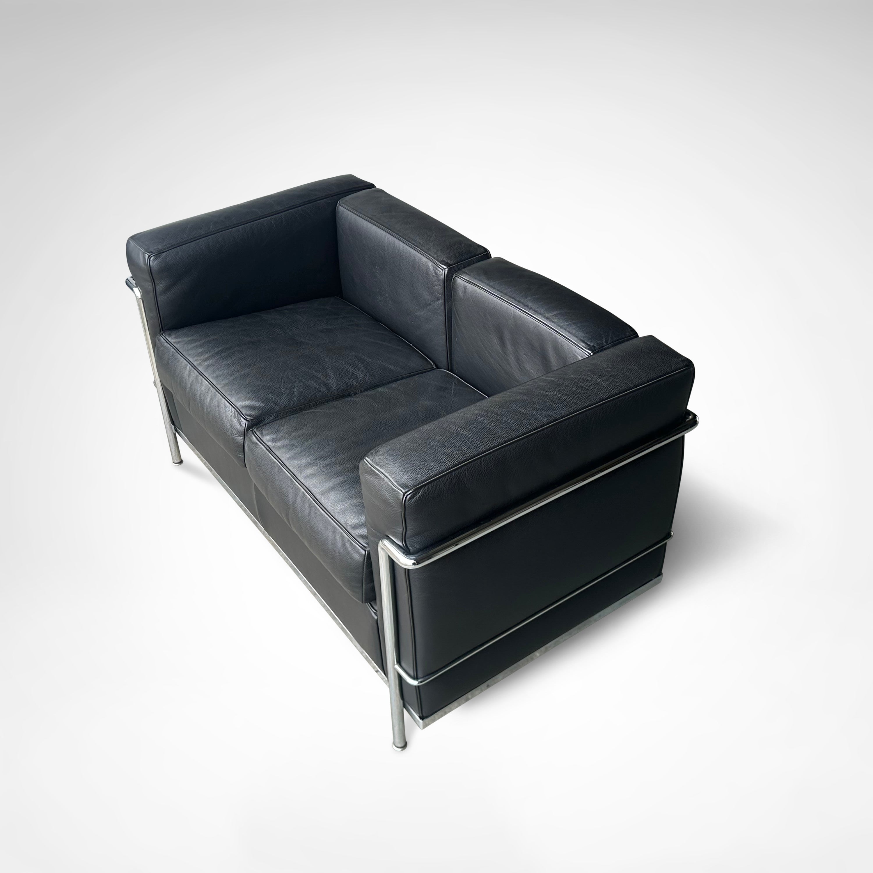 LC2 2-seater sofa by Le Corbusier et al. for Cassina 1990s — back view showing black leather upholstery and chrome frame