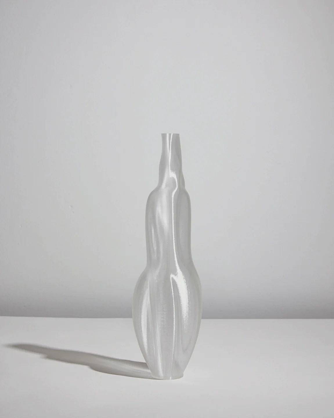 Éson Vessel — top view of translucent glass design on white surface