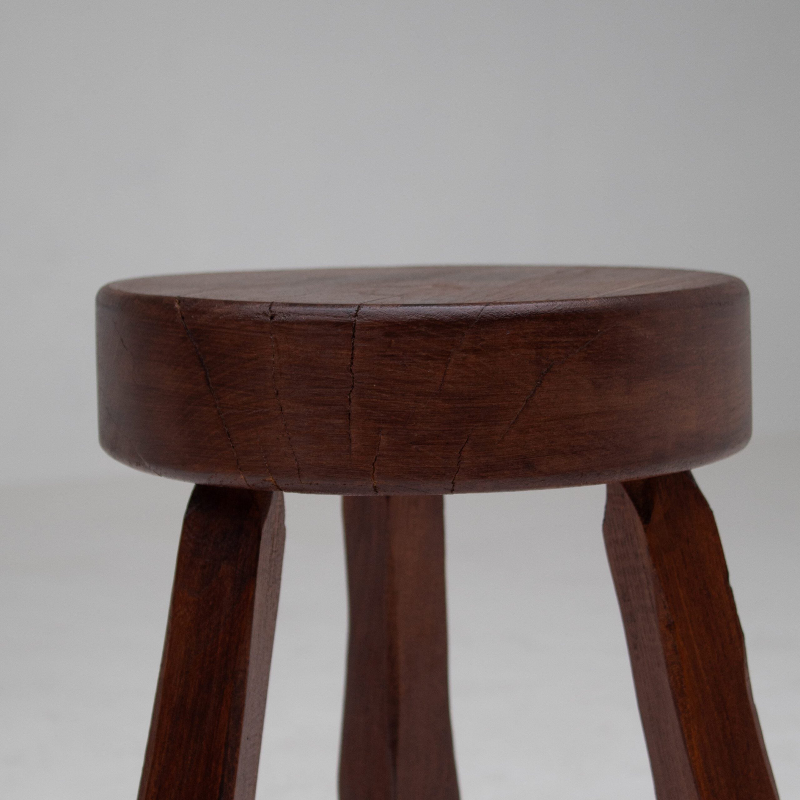 Round Wooden Stool — angled view highlighting sturdy wooden legs