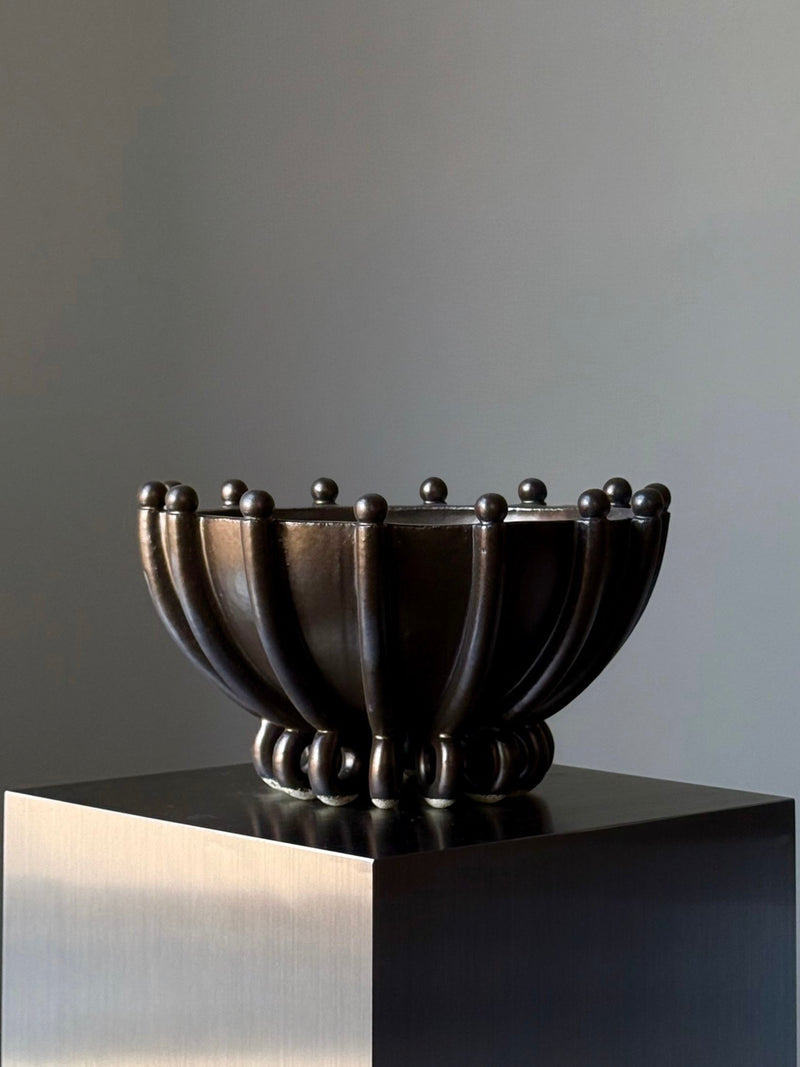 Contemporary black ceramic vase with sculptural ribbed design