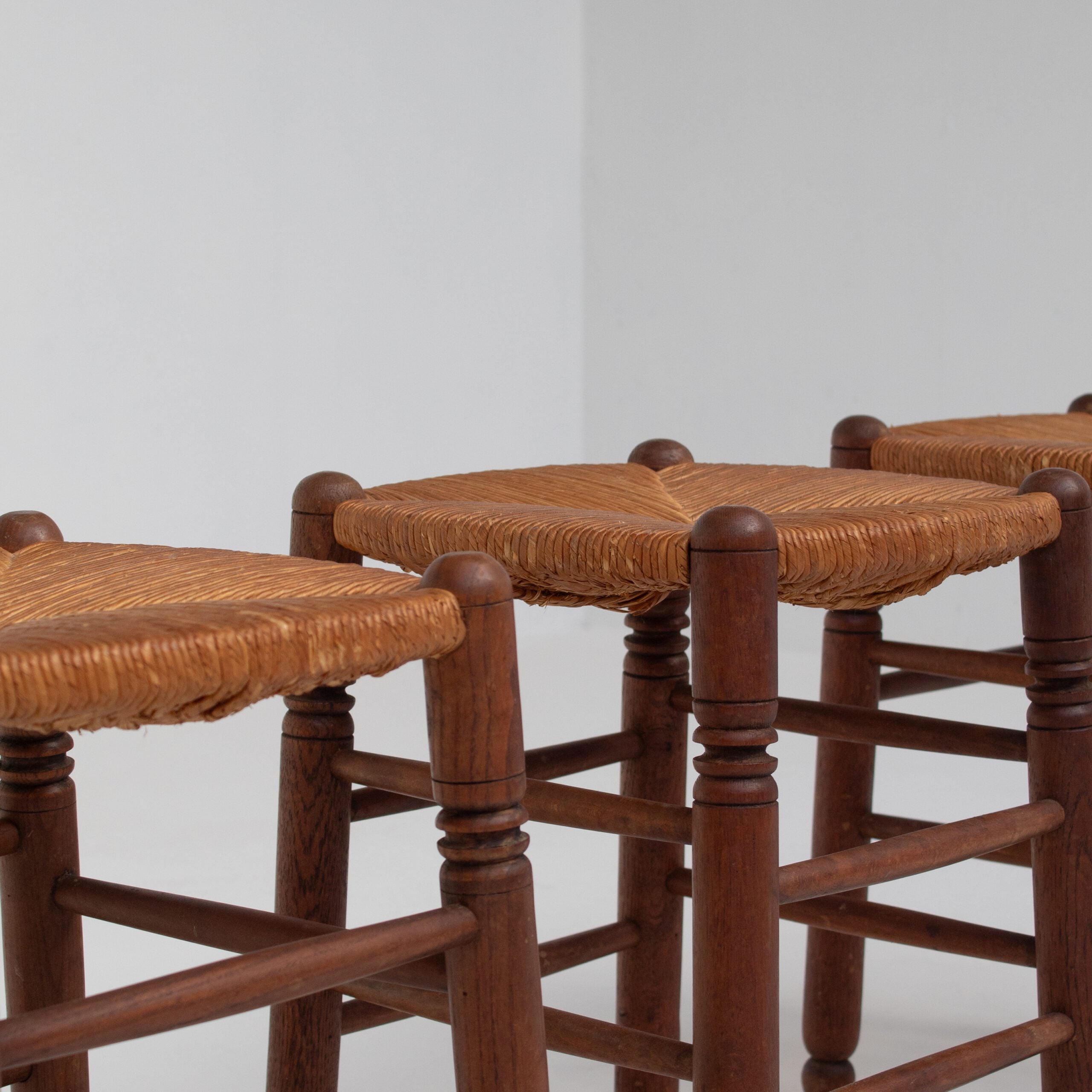 Set of 3 French Rattan Top Stools in Solid Wood — side angle showing woven rattan seats