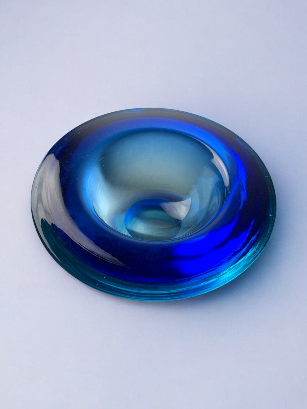 Circular blue Murano glass tray by Flavio Poli — lifestyle setting