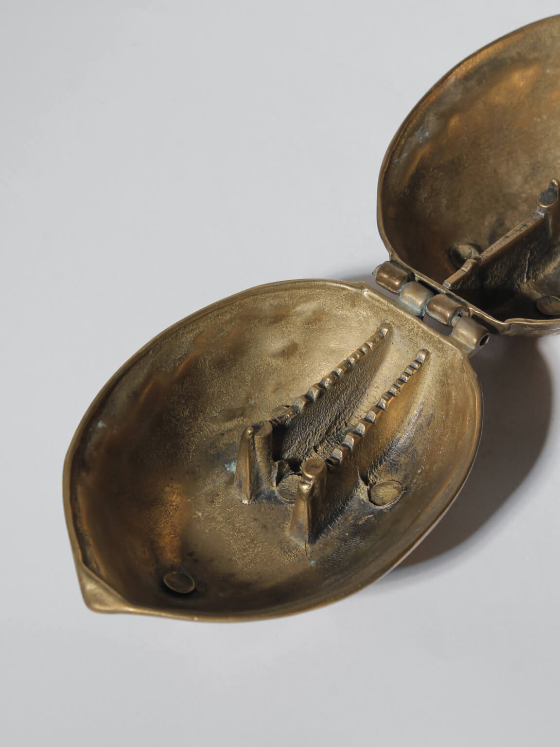 Vintage Brass Nutcracker Walnut, 1960s — interior view showing textured brass mechanism