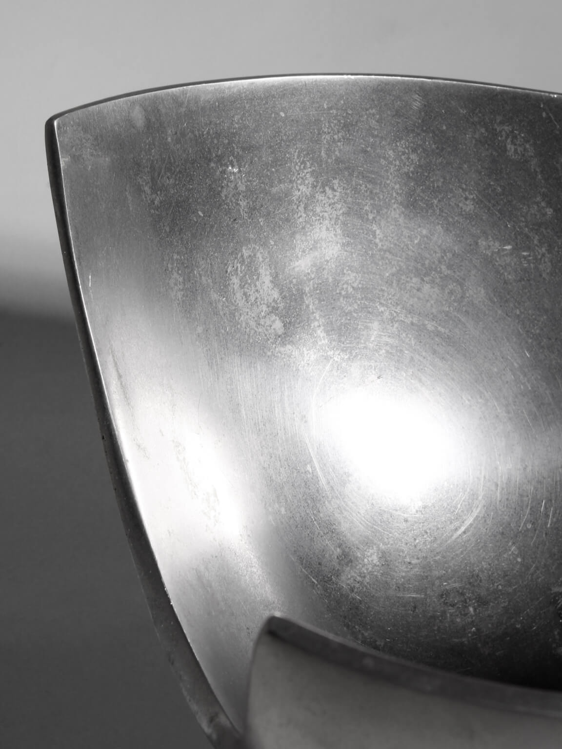 Polished Aluminum Asymmetric Contemporary Deep Bowl, Medium — lifestyle setting