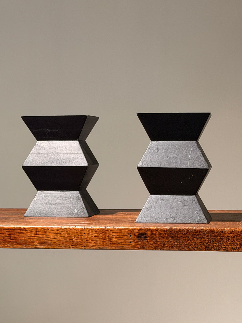 Pair of geometric black wooden candlesticks, anonymous work — detail view