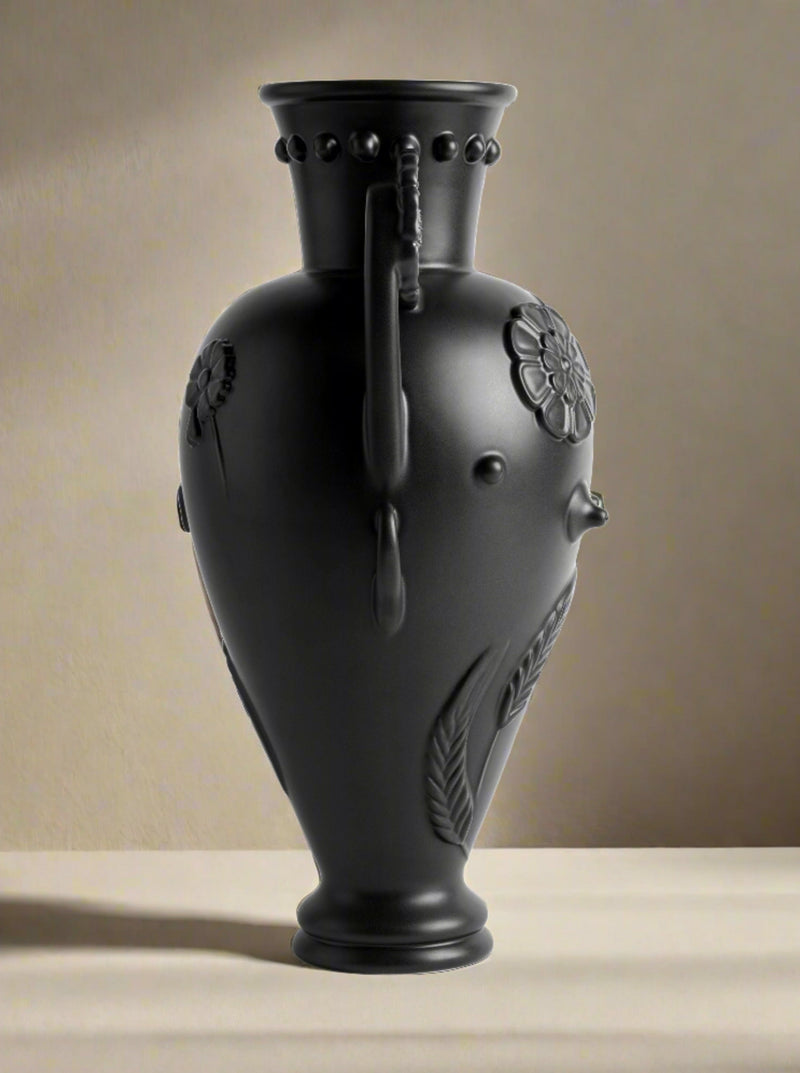 Black Earthenware Vase — close-up of textured black surface with floral design