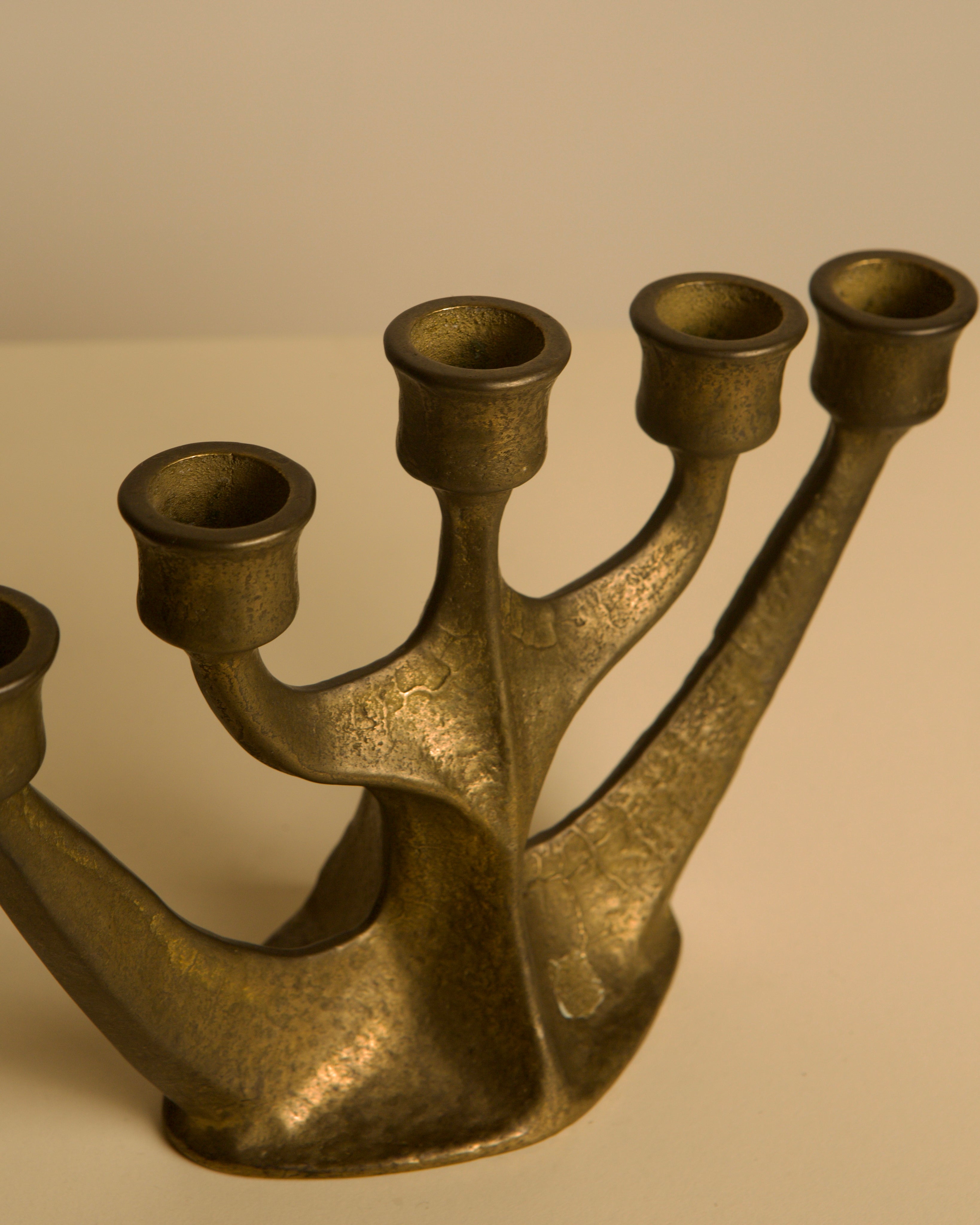 Five-branch Brass Candleholder by Michael Harjes, 1960s — side angle highlighting textured brass finish