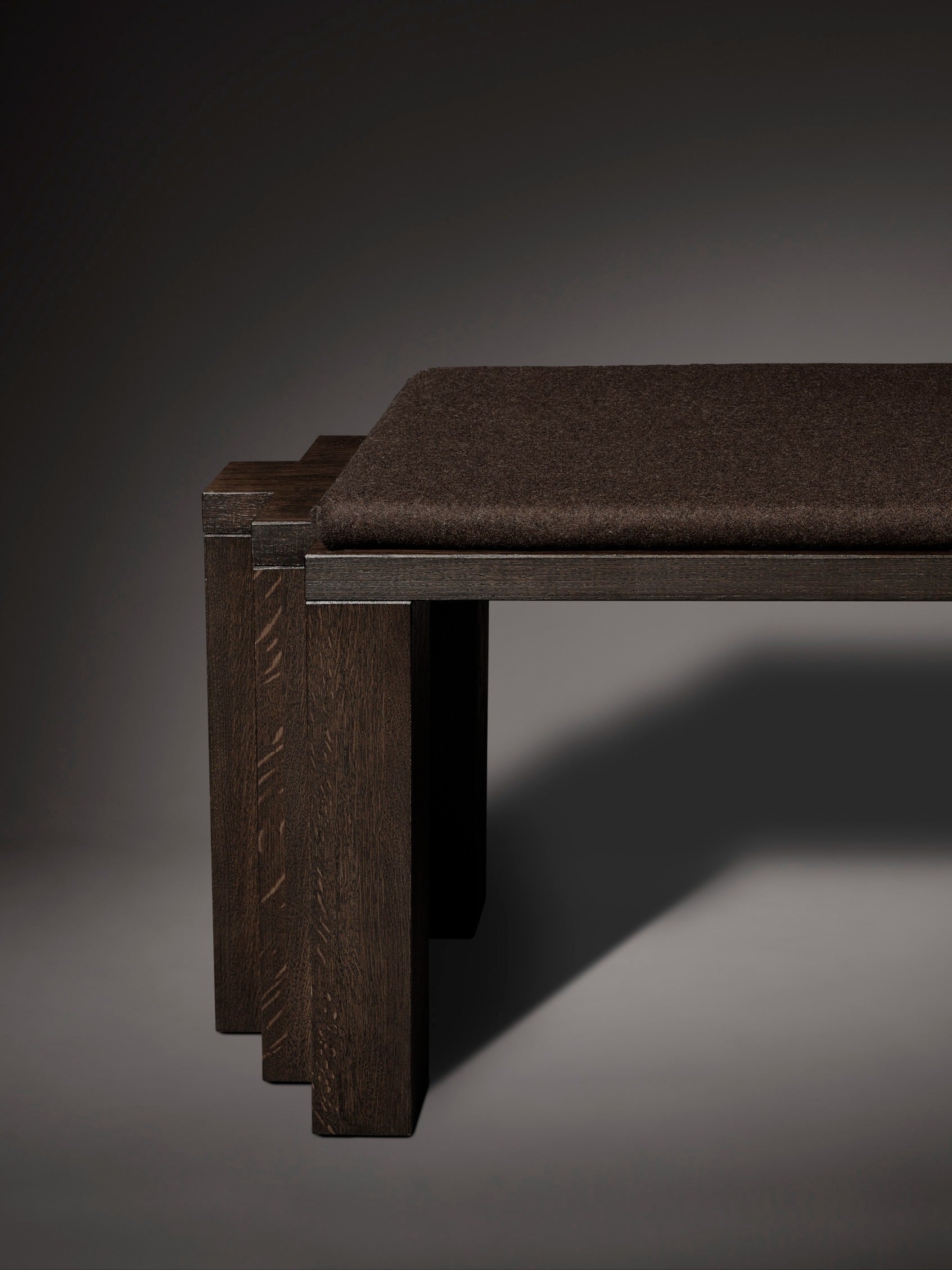 Cadence Bench — side view highlighting dark wood and fabric seat