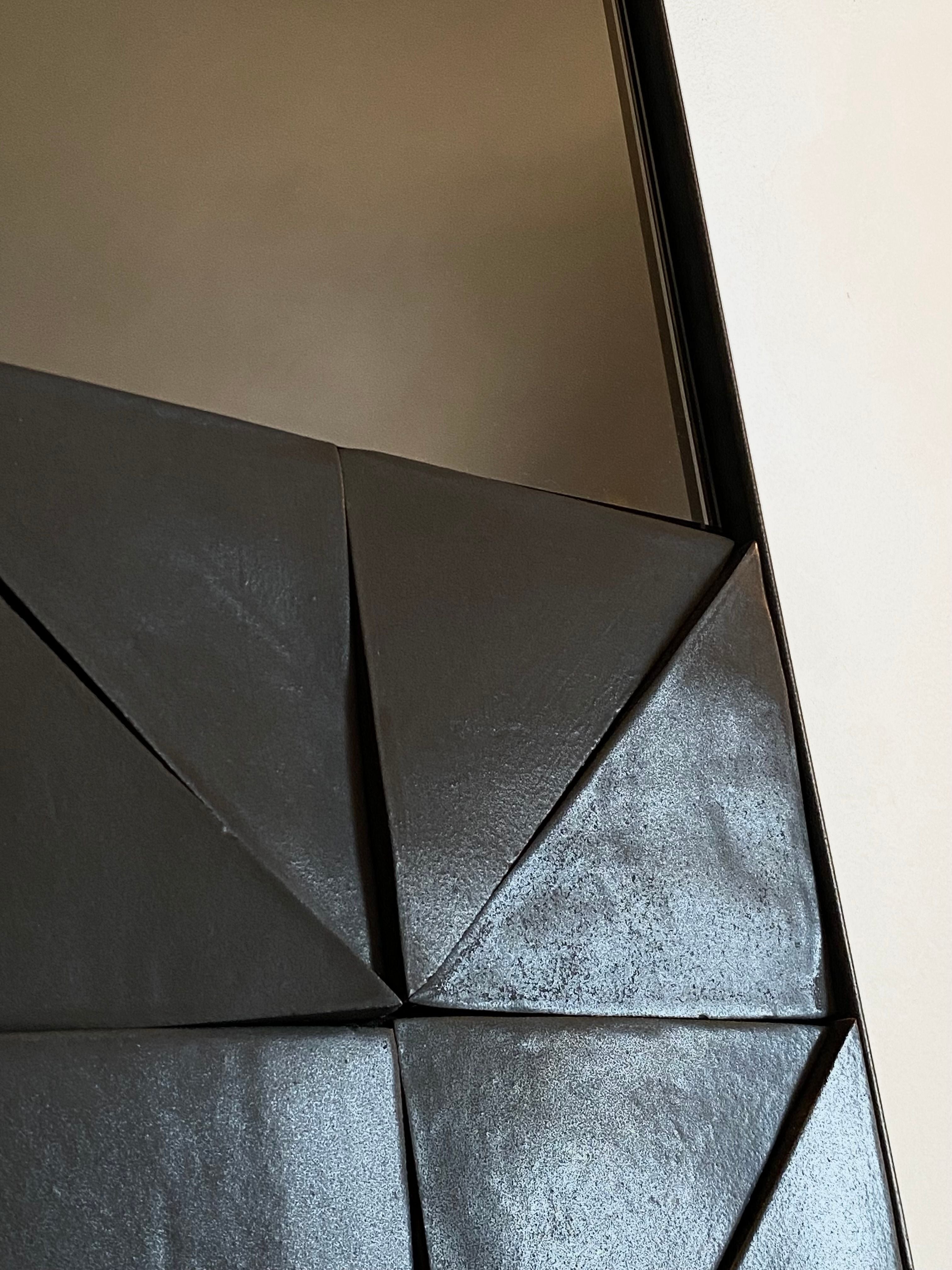 Alcoa mirror geometric faceted surface detail view