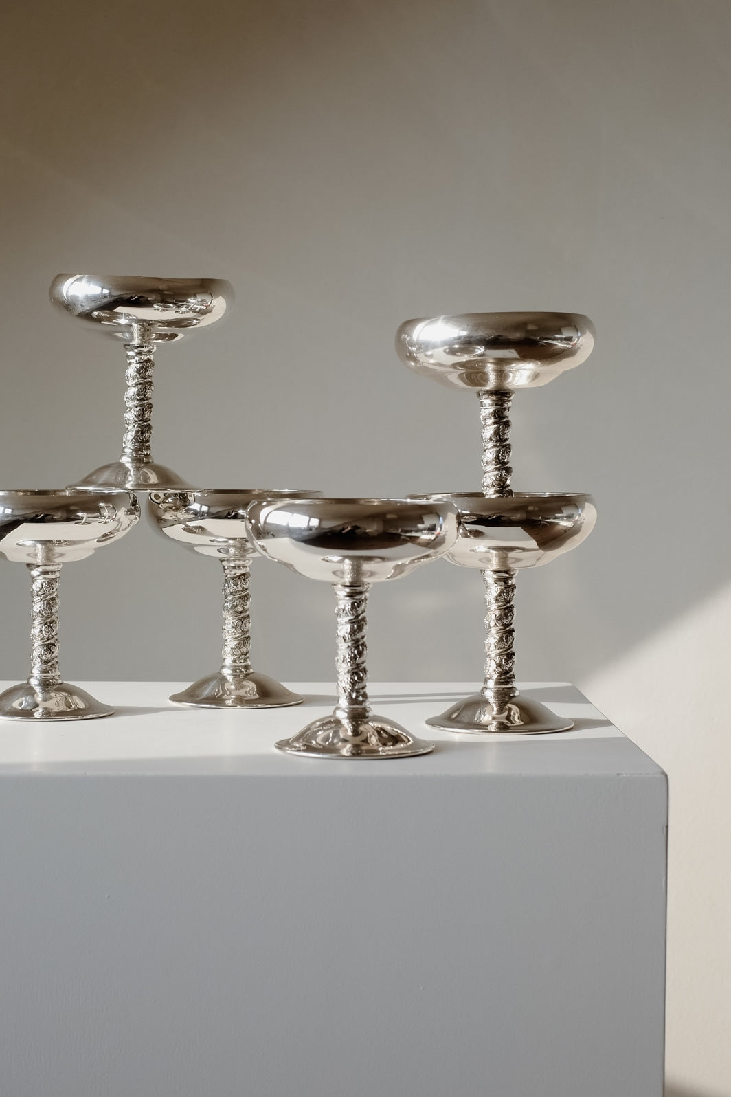 Set of 6 Silver Coupes — side angle on white pedestal