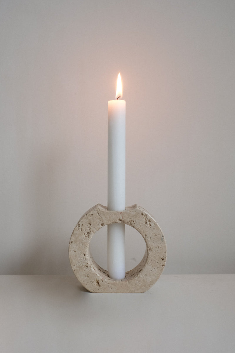 Travertine Candle Holder — close-up of circular stone base with white candle