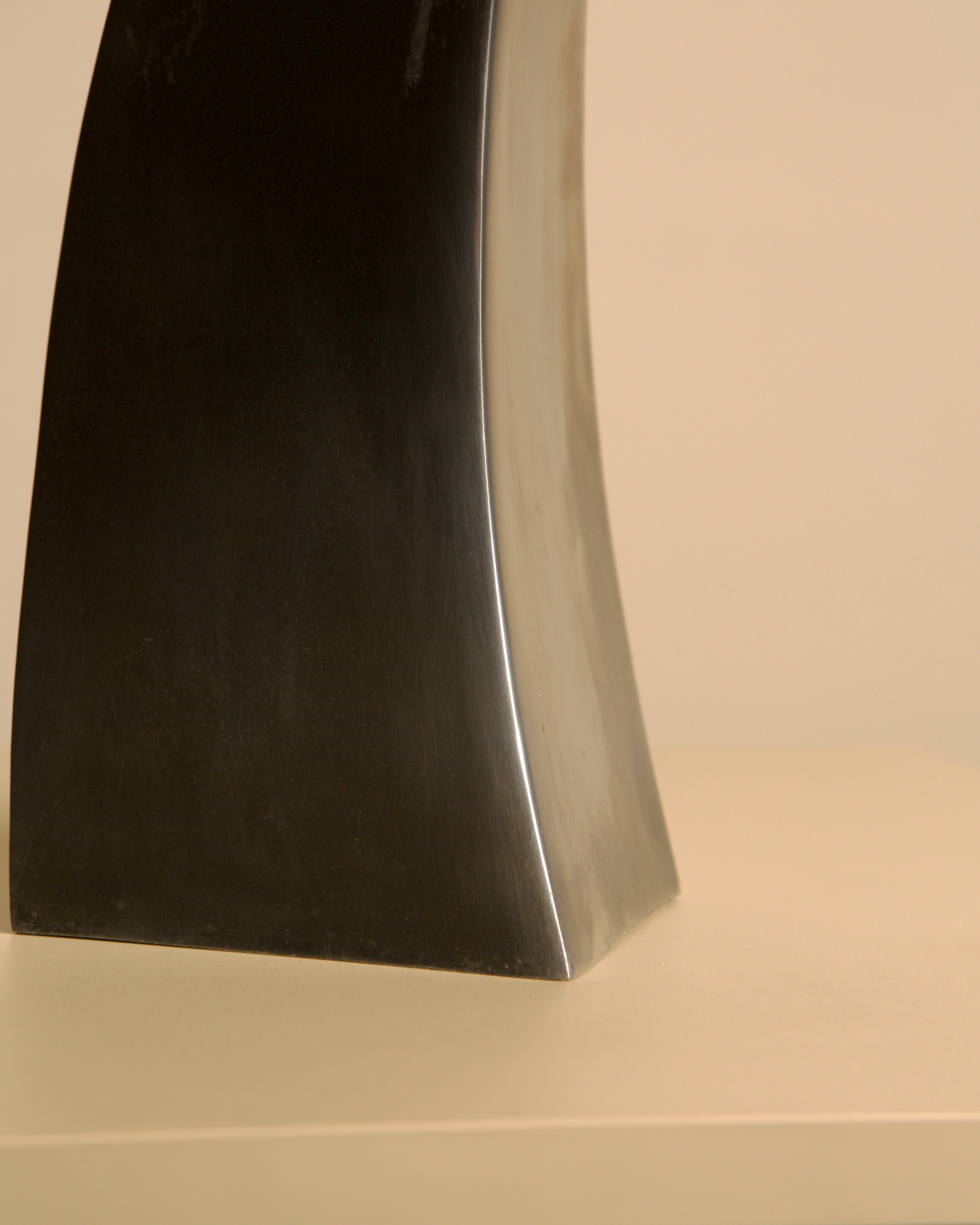 Corne vase in cast aluminum, 80s — side angle on neutral background
