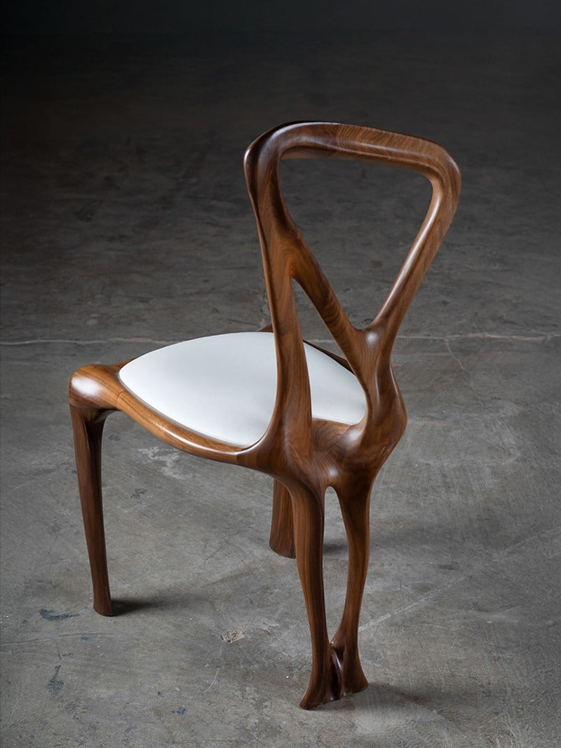Gazelle Chair in Walnut Wood — side angle highlighting curved backrest
