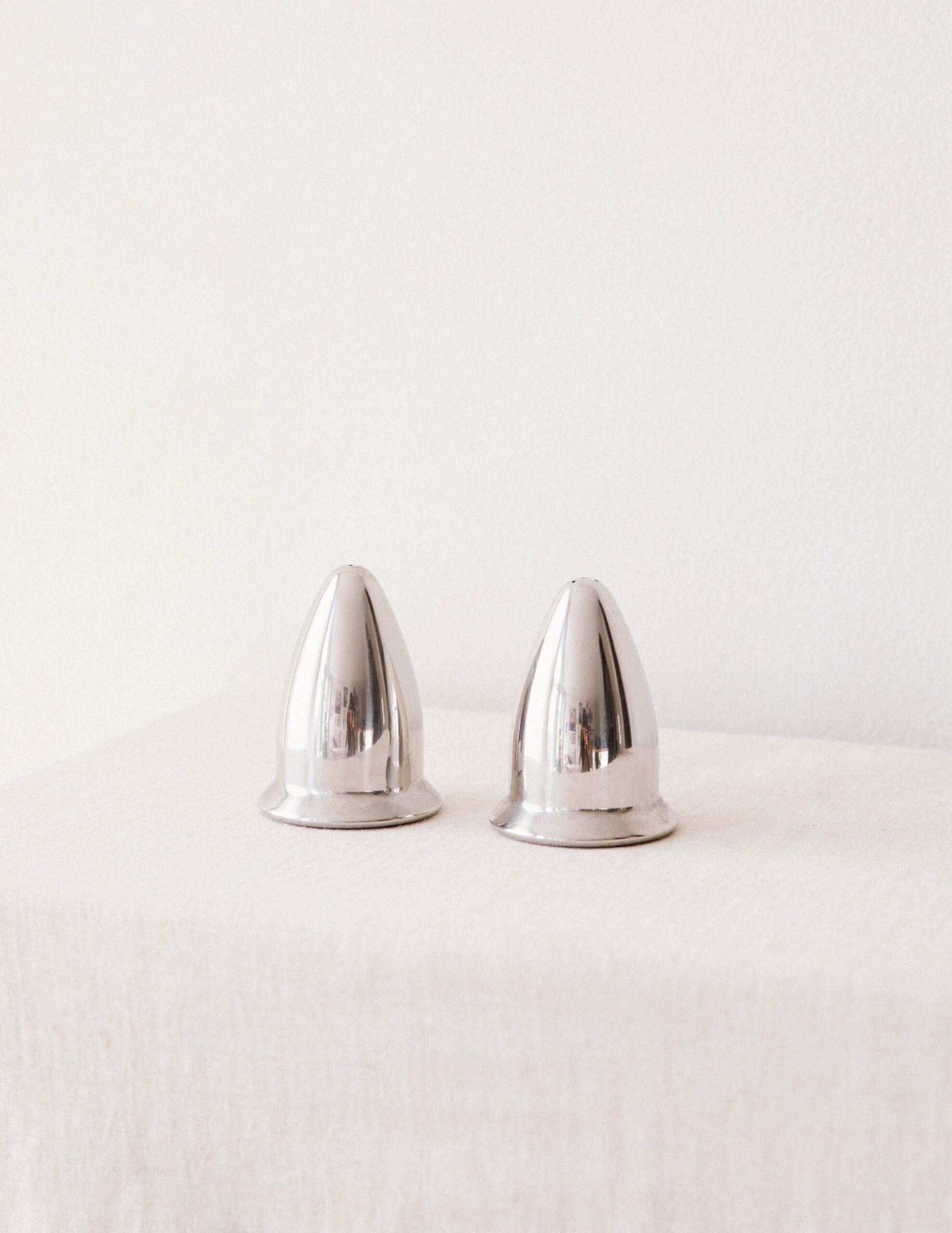 Chrome Salt & Pepper Shakers — close-up of polished chrome surface