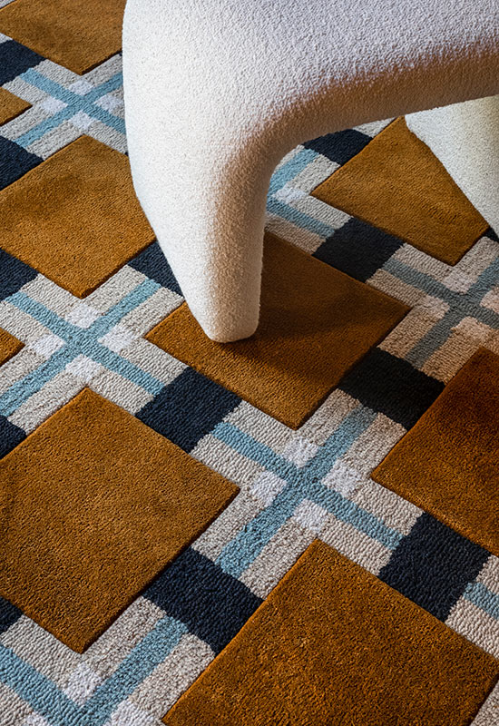 'Ochre Fields' Handmade Wool Rug by Evelina Kroon — lifestyle setting