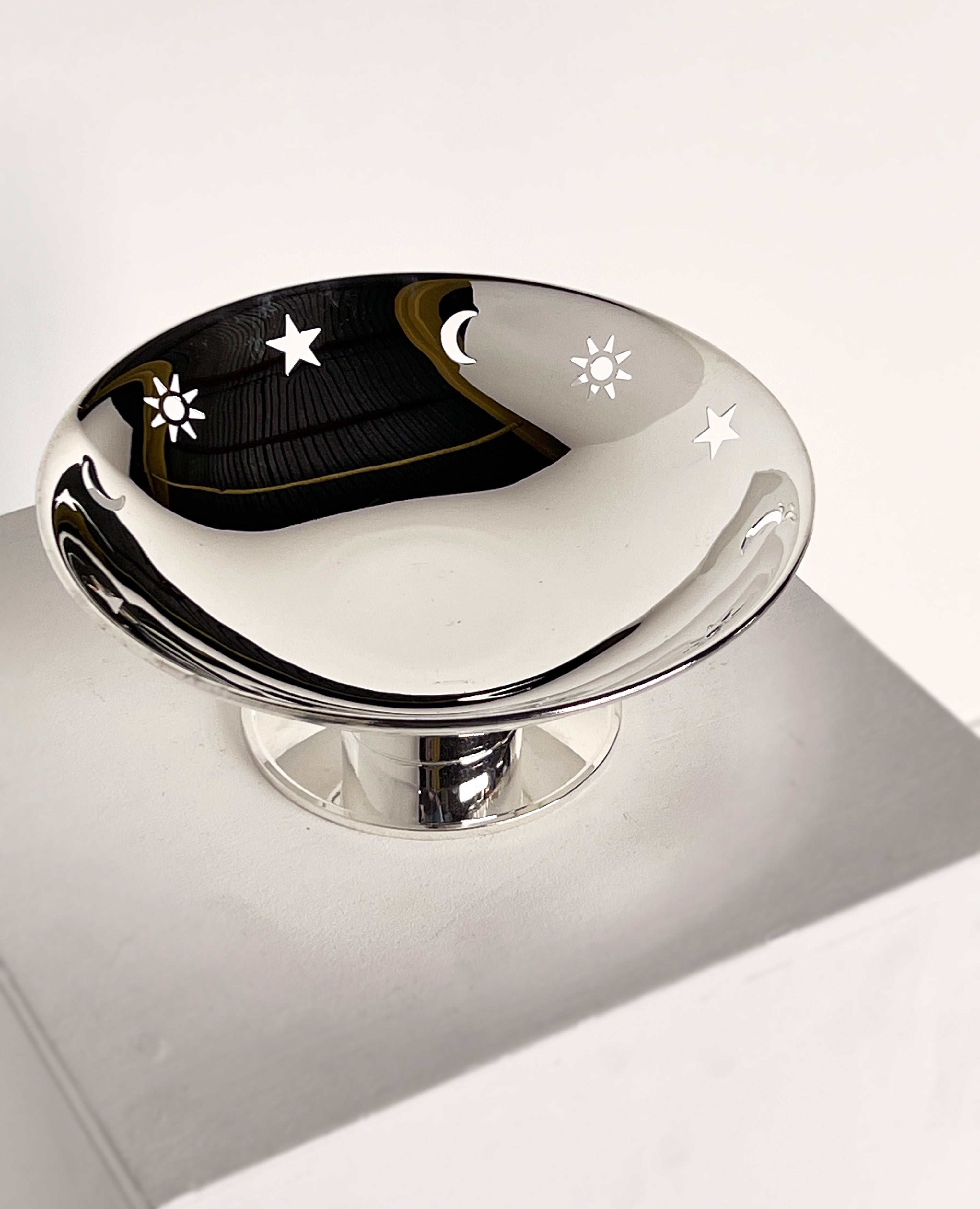 Star, sun, moon dish on pedestal  — side angle
