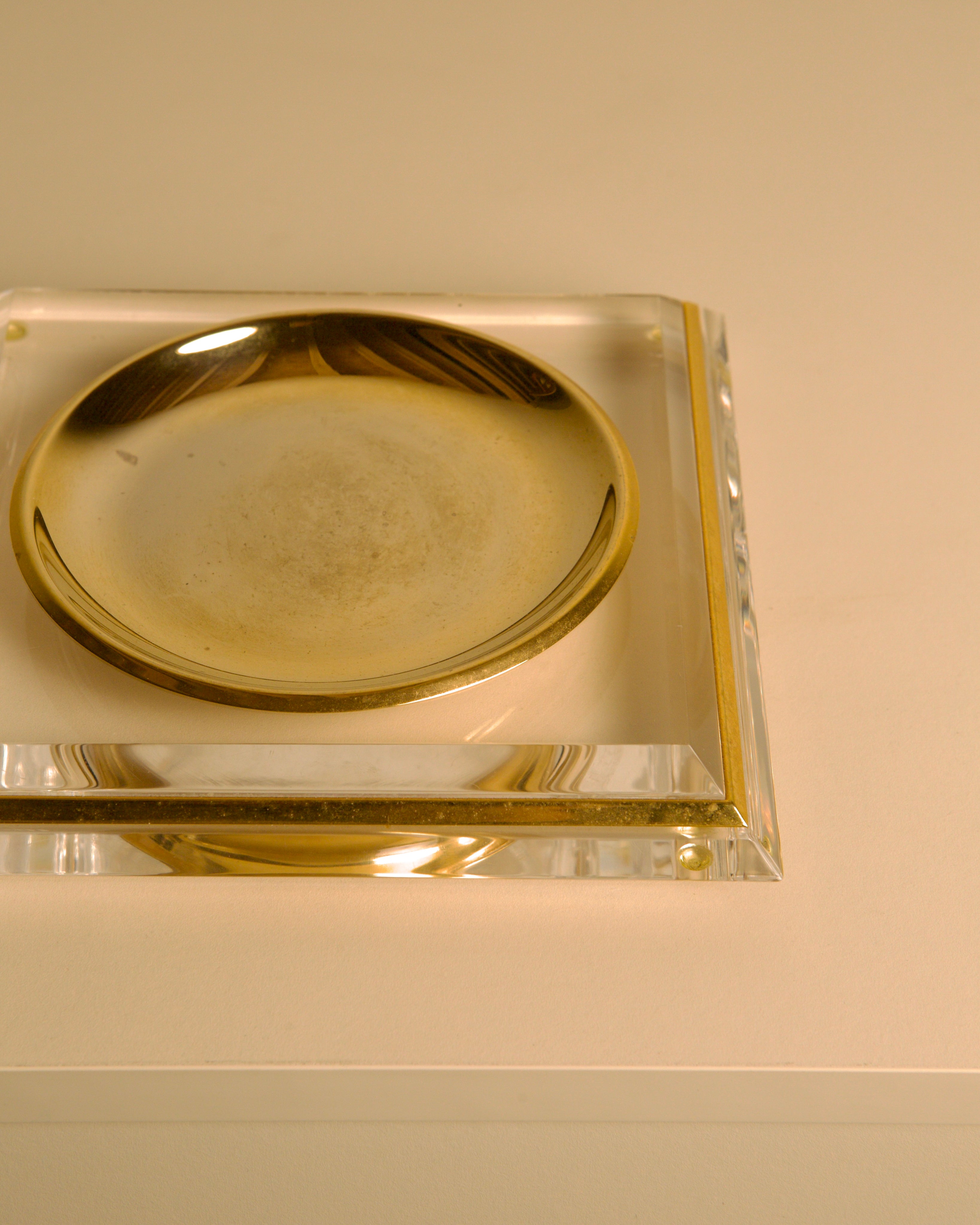 Italian "Pyramid" Trinket Dish in Brass and Plexiglass, 70s — angled view on neutral background