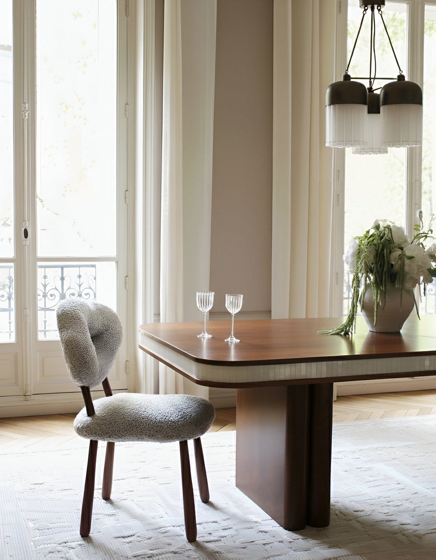 Doppio Wood And White Onyx Dining Table — angled view in modern dining room